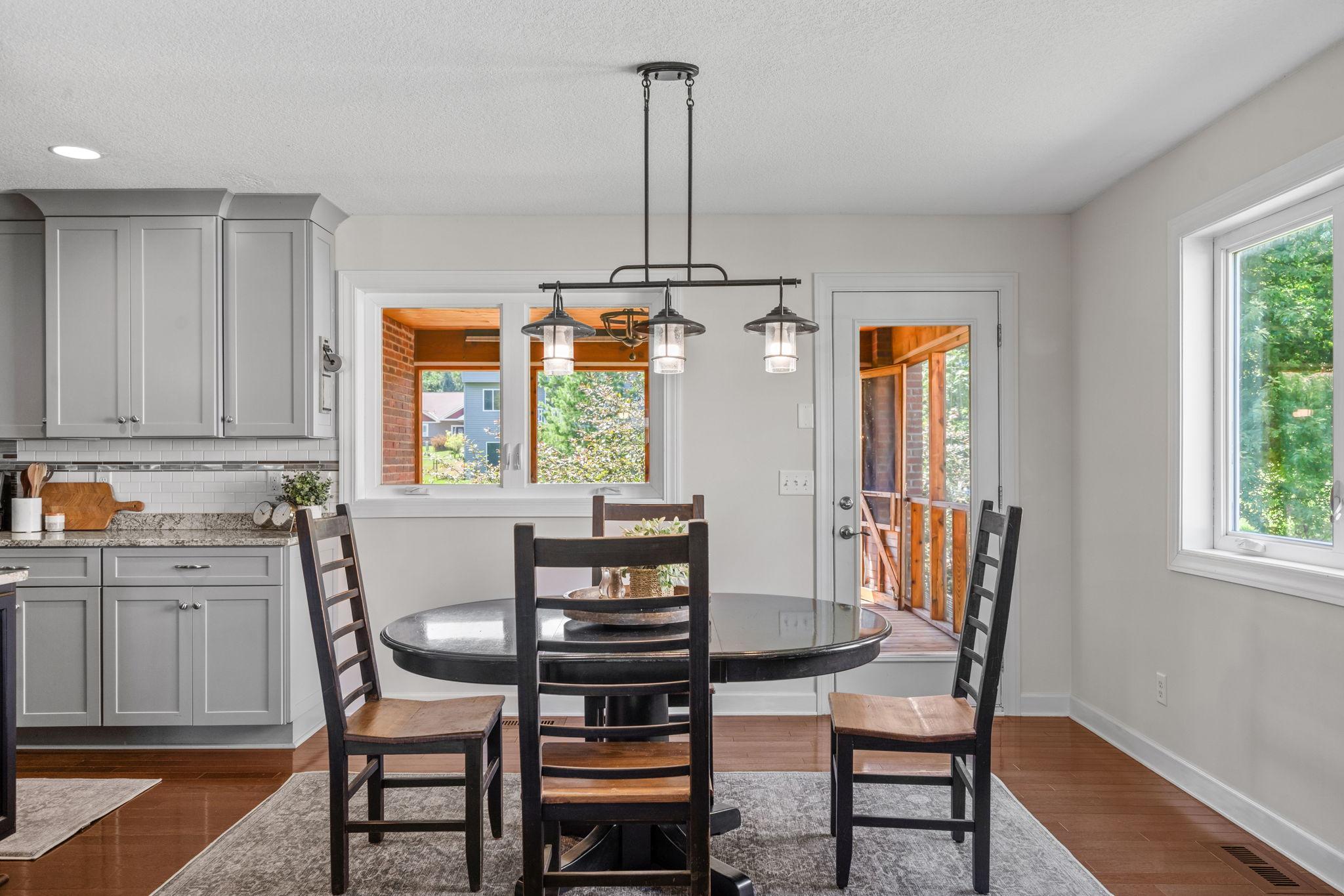 Bright dining area with easy access to the screened porch.