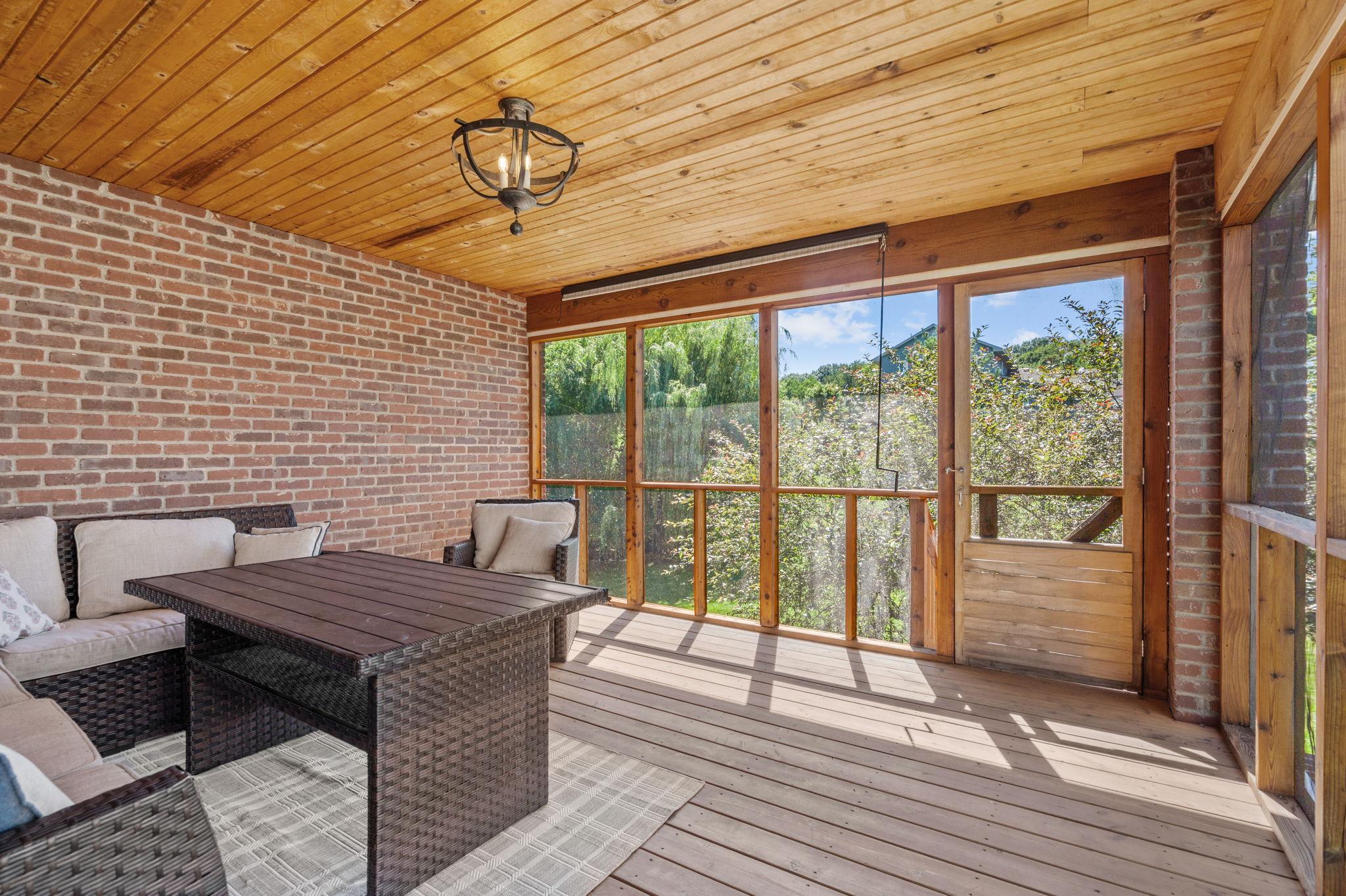 Enjoy peaceful backyard views from the spacious screened porch.