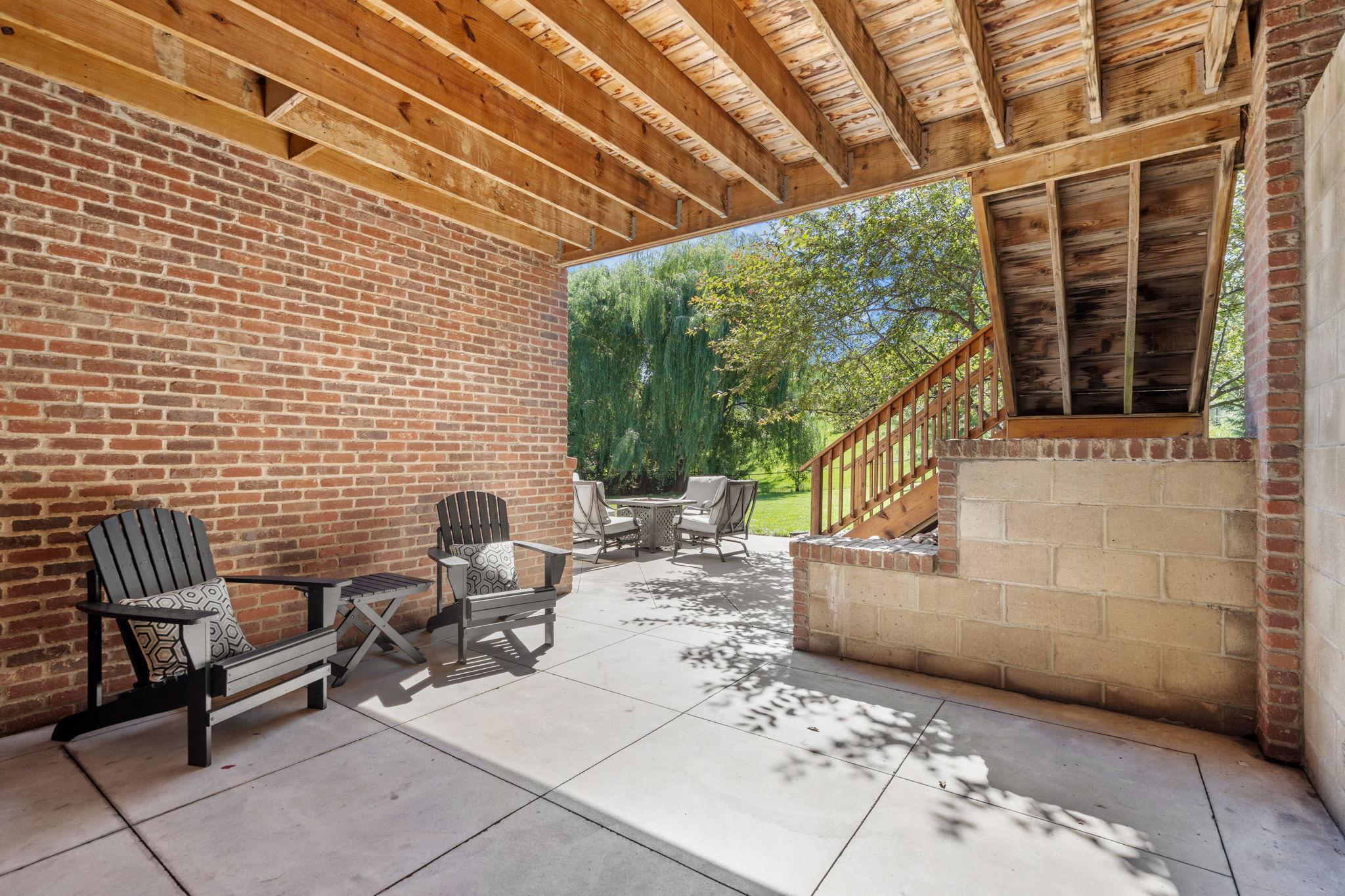 Covered patio provides additional outdoor living space.