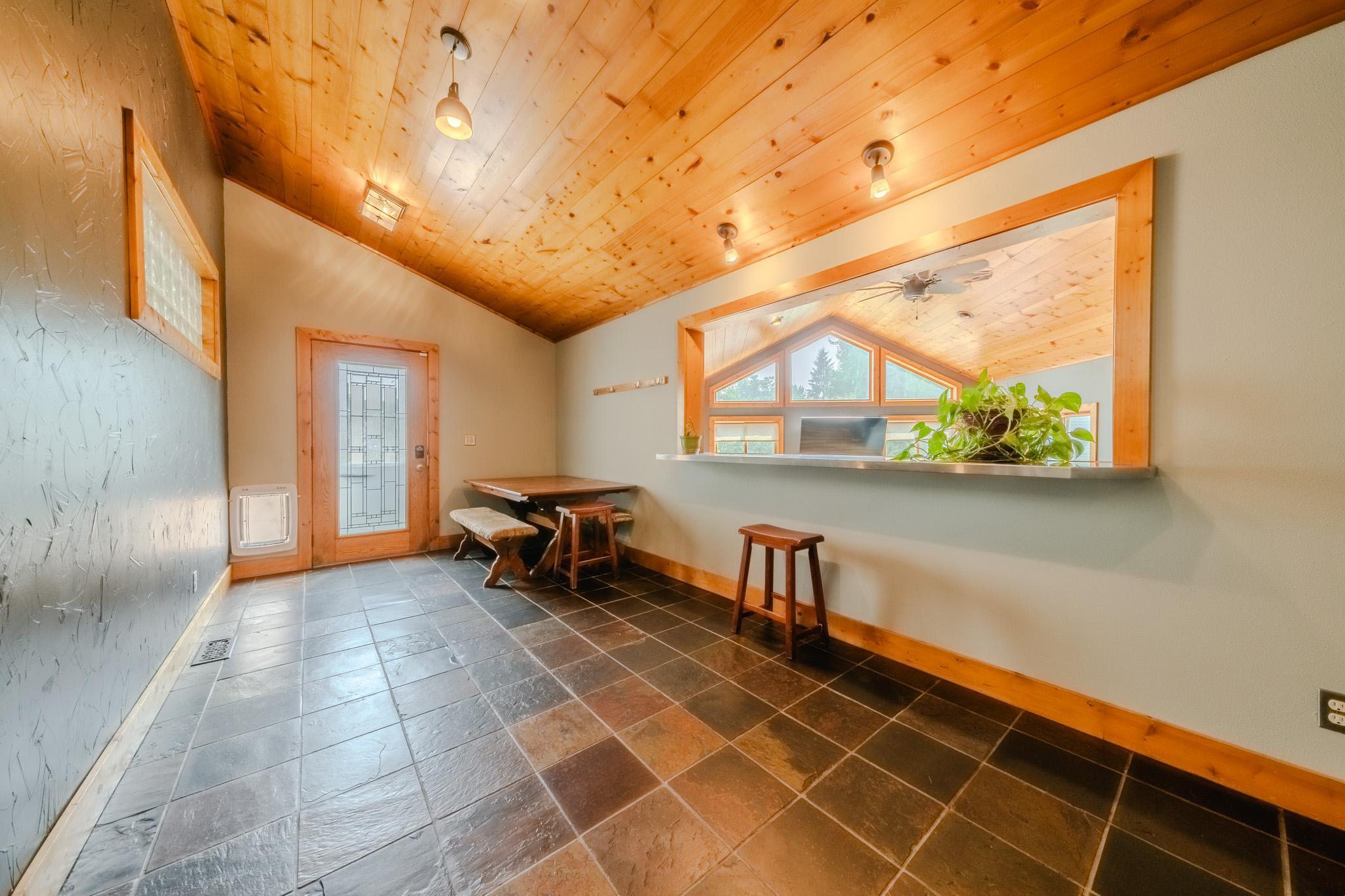 Backyard door to Foyer entrance into main living areas