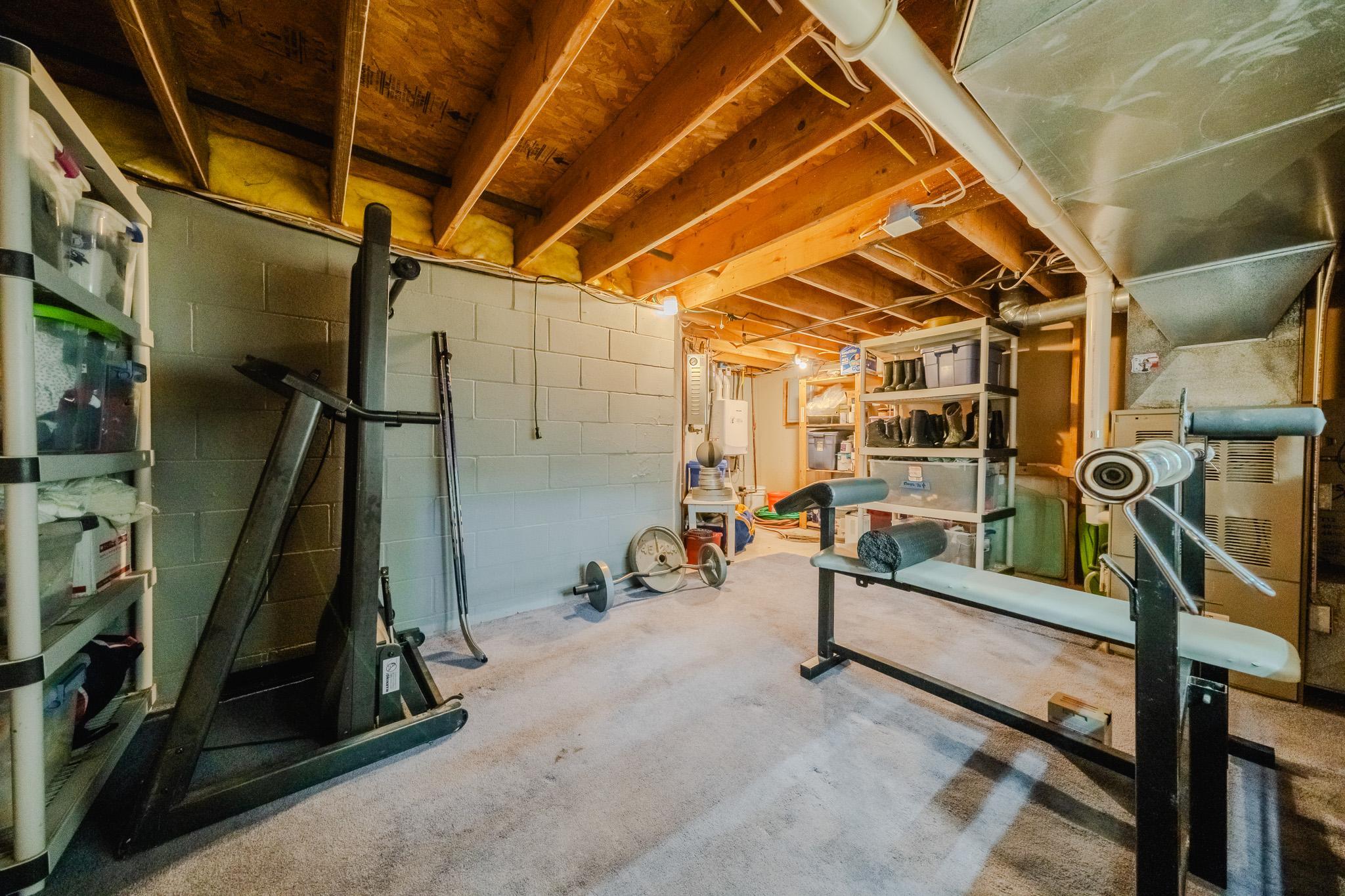 Extra furnace for gym with utilities hot water heater and storage