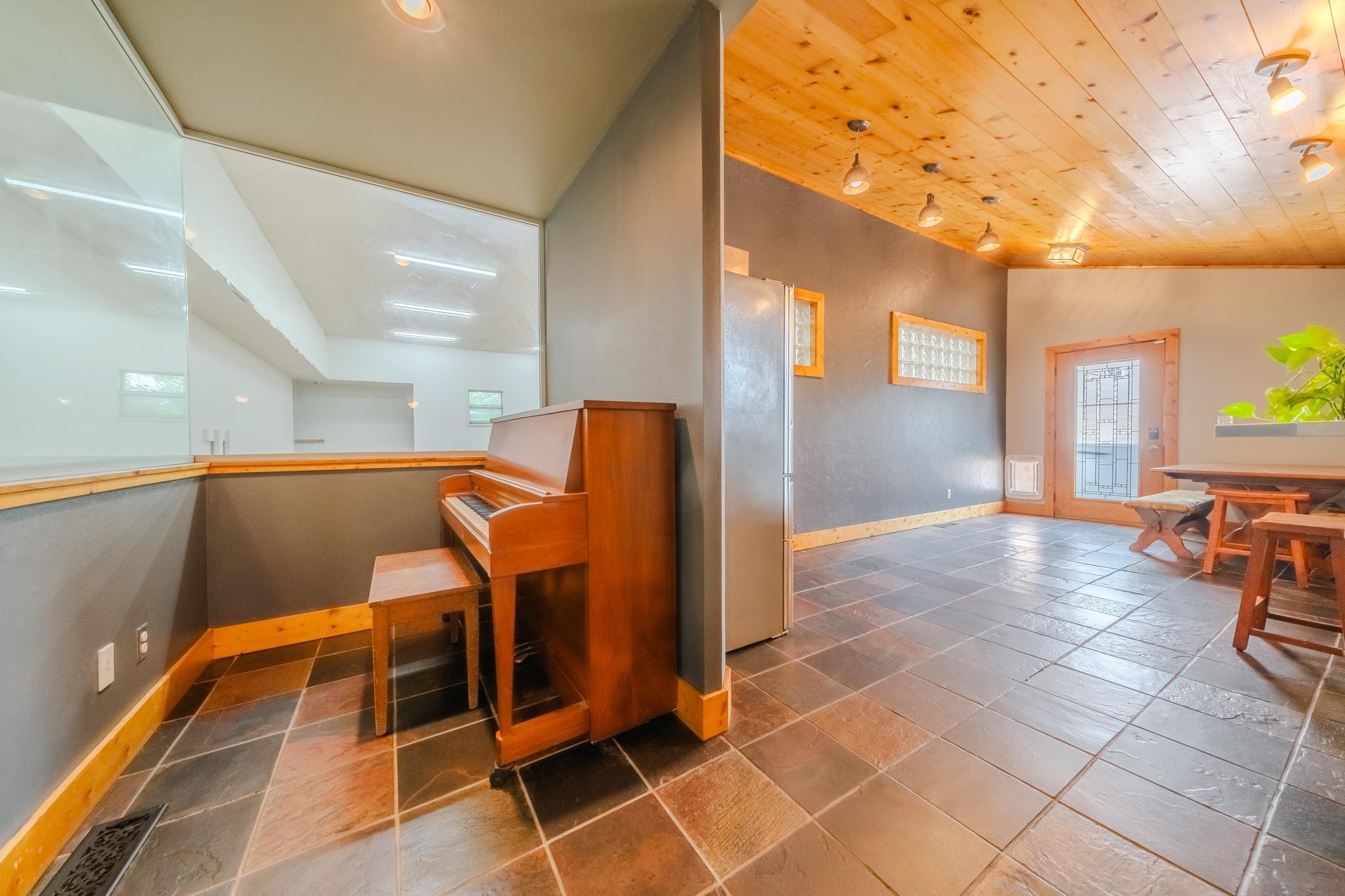 Foyer and entrance to both gym and backyard