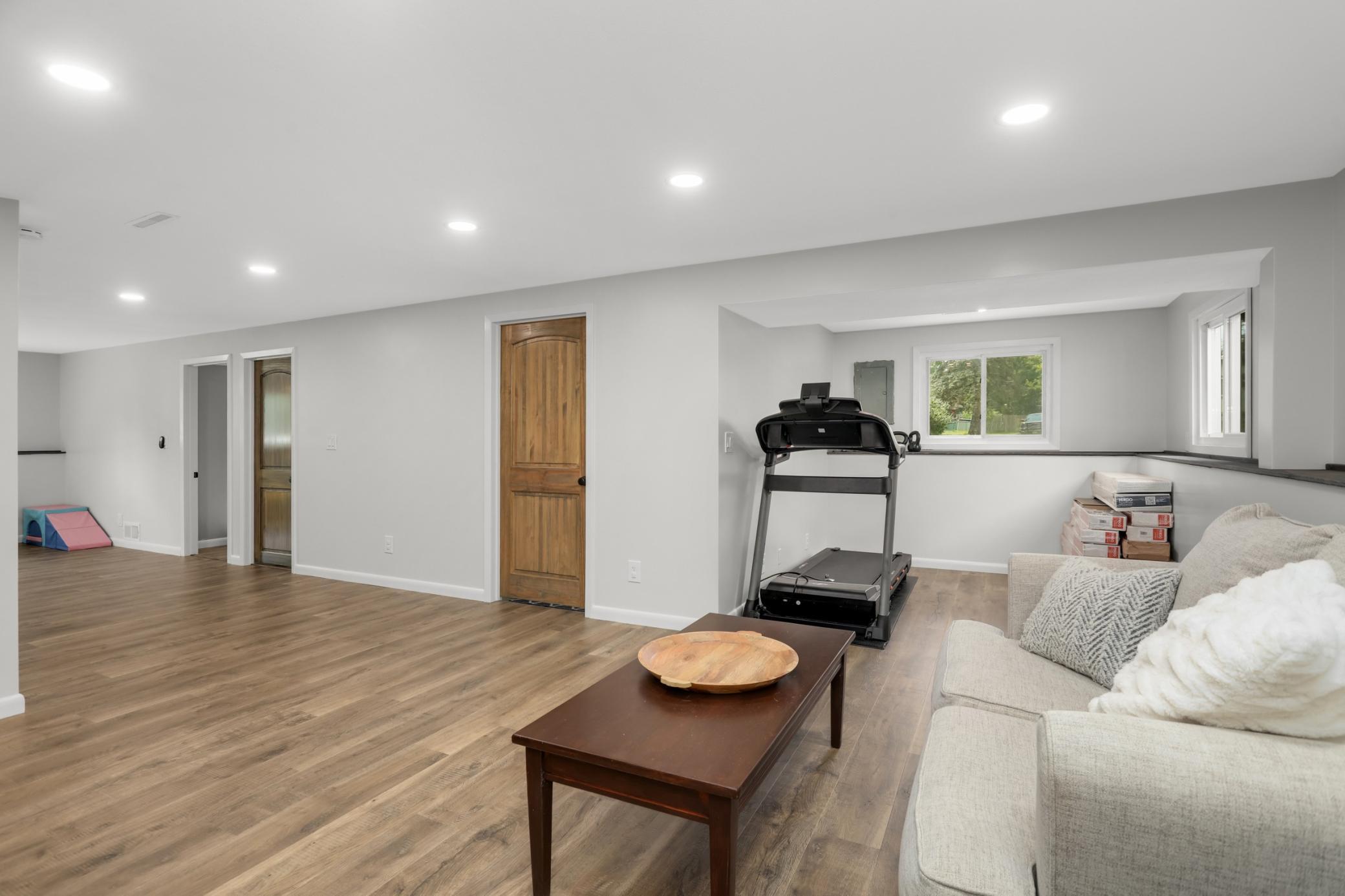 3rd bedroom, bathroom and laundry are located off the family room. Niche area could be a great workout space or home office.