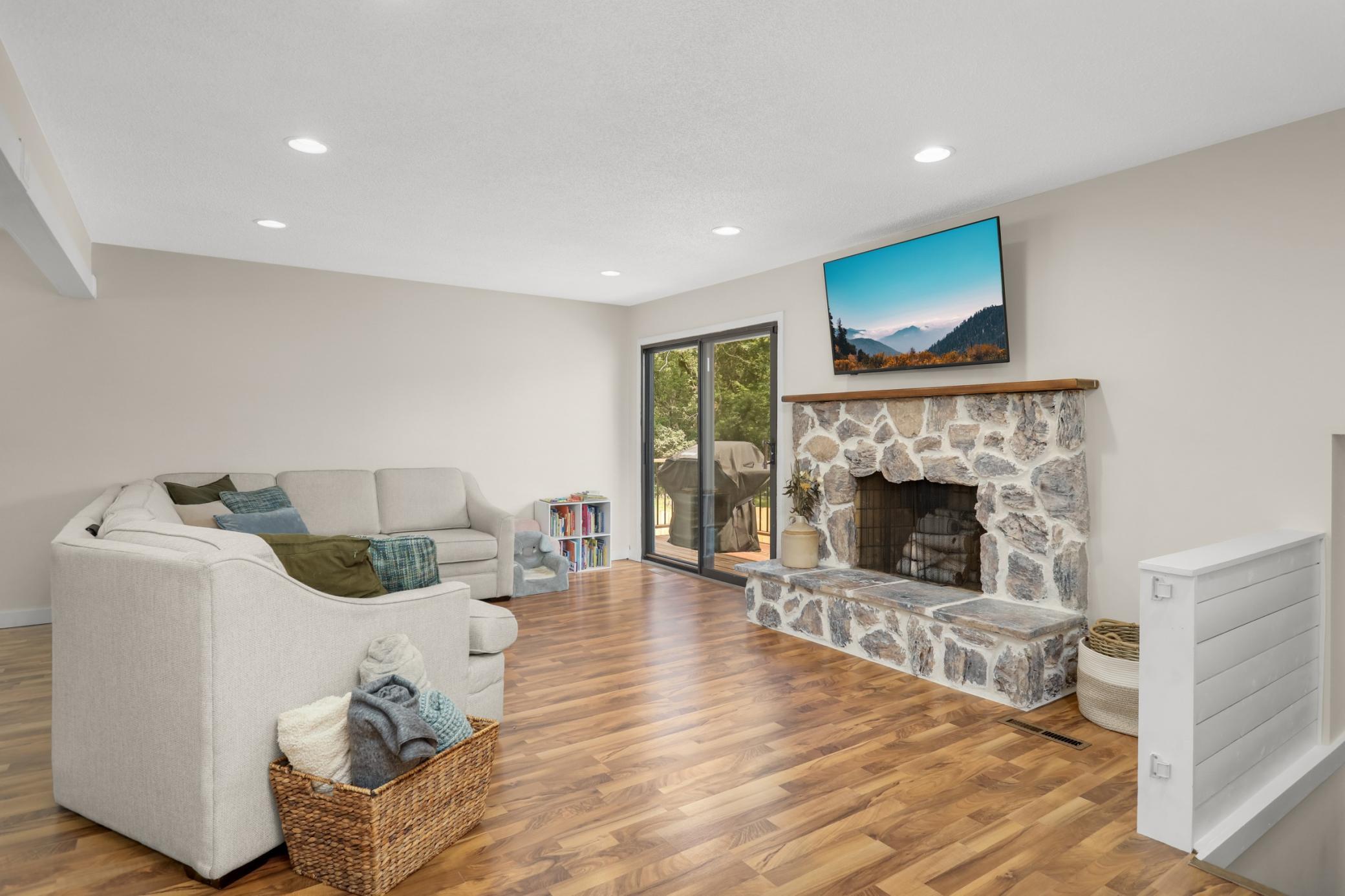 Upper level living room with gorgeous stone fireplace