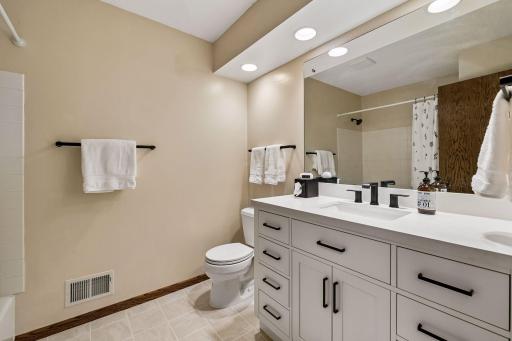 Updated guest bathroom is convenient for family and overnight guests.