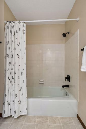 Full guest bathroom complete with tub and shower.