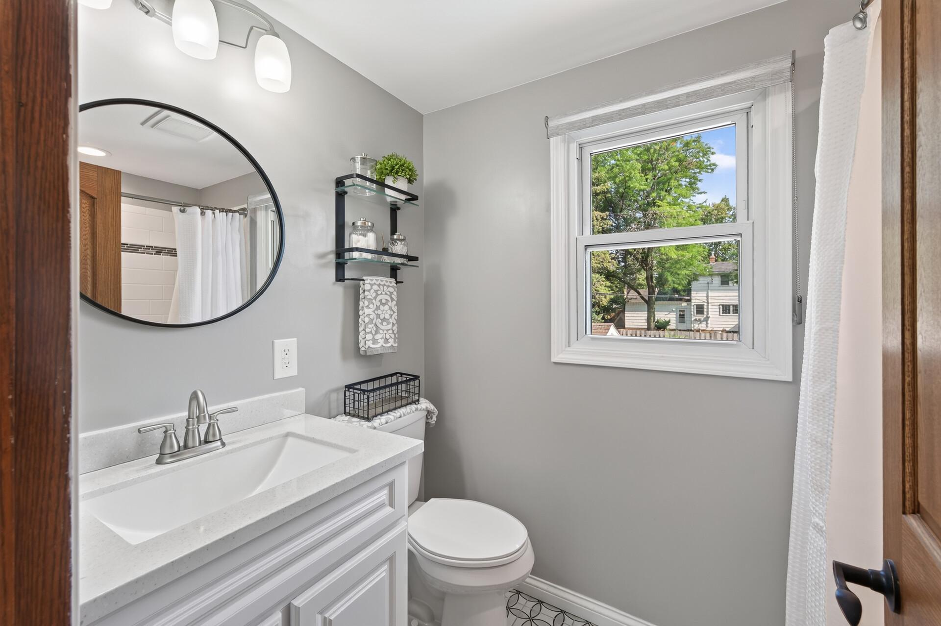 Updated full bathroom on upper level.