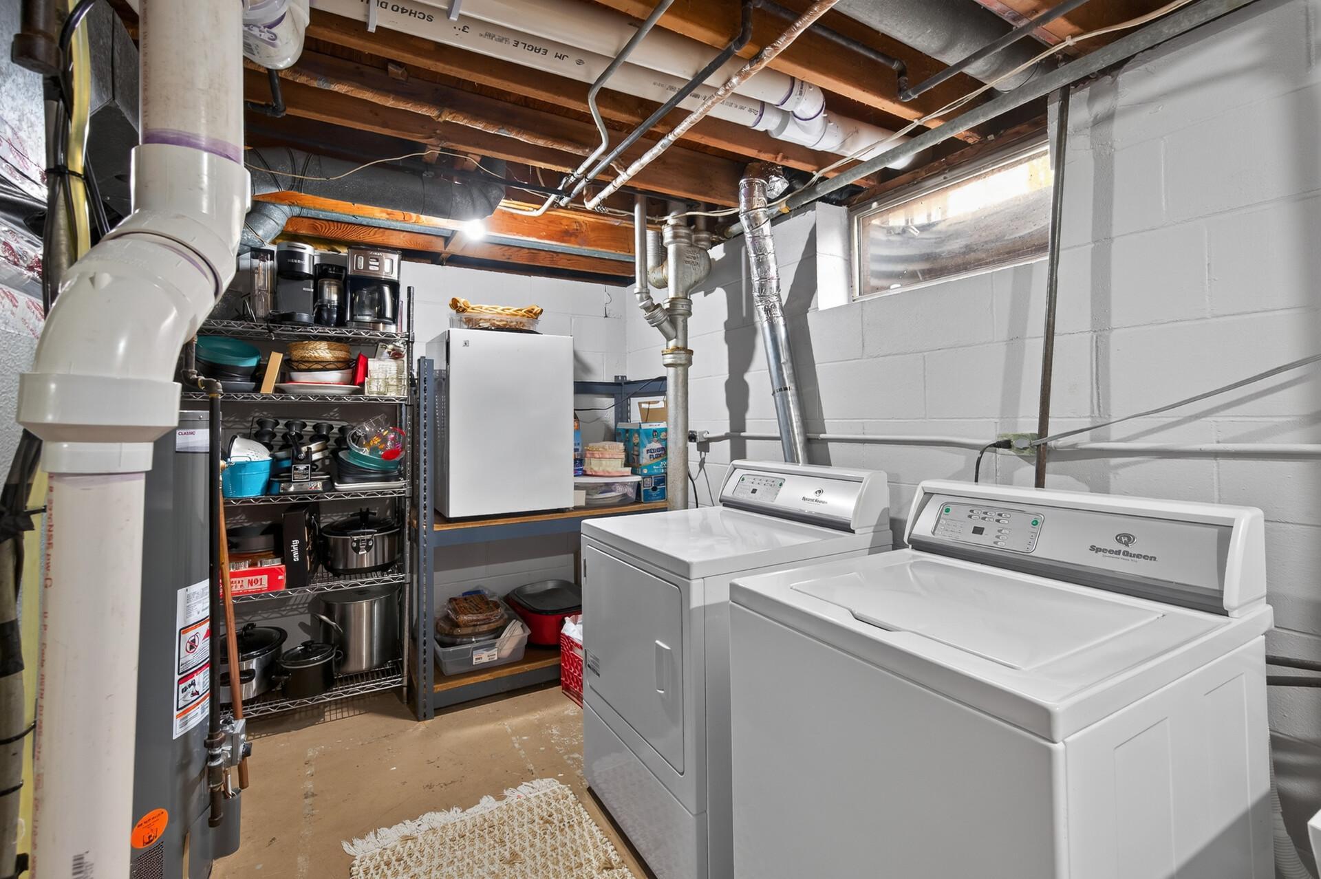 Utility room and laundry room on lower level.