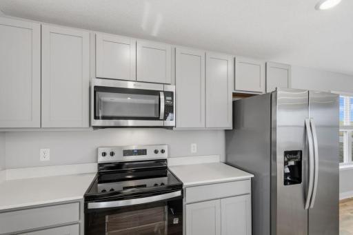 Whirlpool stainless steel appliances. Model photos. Options and colors will vary.