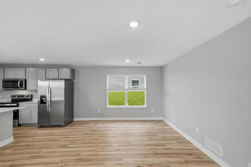 Another view of the main floor living space. Model photos. Options and colors will vary.