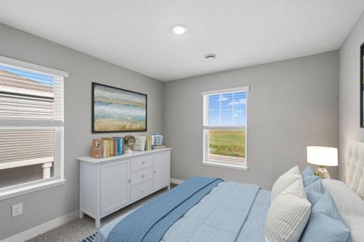 3rd spacious, upper-level bedroom. Model photos. Options and colors will vary.