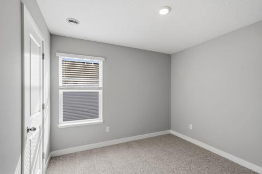 2nd spacious, upper-level bedroom. Model photos. Options and colors will vary.