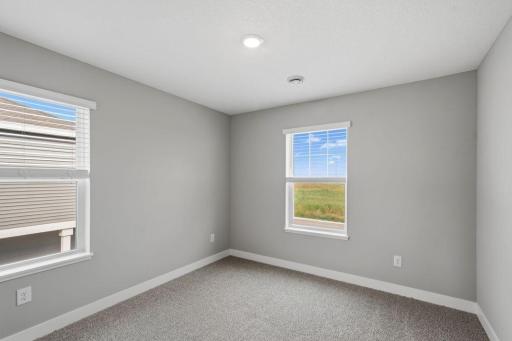 3rd spacious, upper-level bedroom. Model photos. Options and colors will vary.