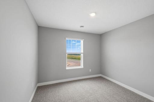 4th spacious, upper-level bedroom. Model photos. Options and colors will vary.
