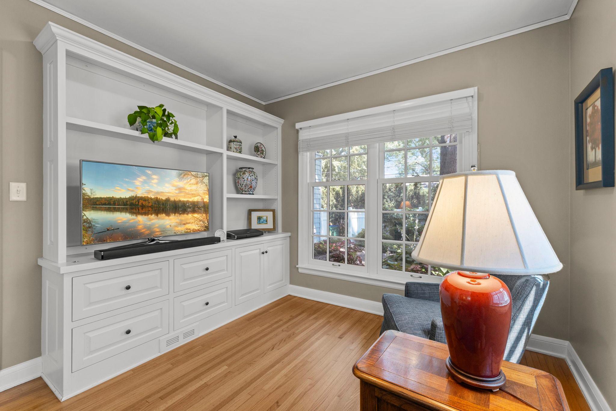 Den includes built-in shelving