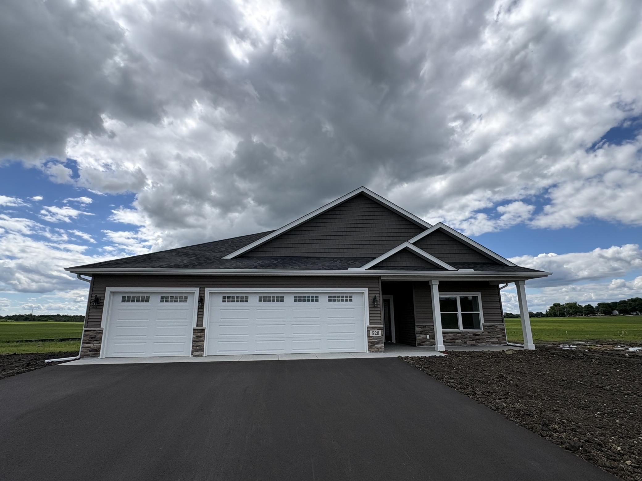 The 3 car garage will house your vehicles and your toys. Garage will be insulated and rocked. Photo is of current model that is sold.