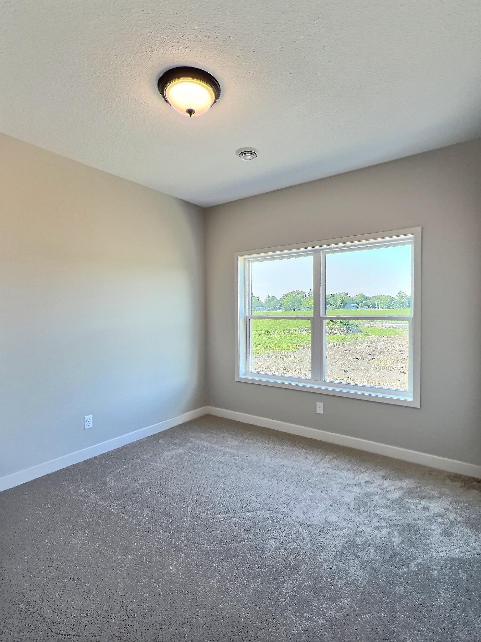 Here is the 2nd bedroom of the home. Perfect for family or guests to stay when visiting. Photo is of current model that is sold.