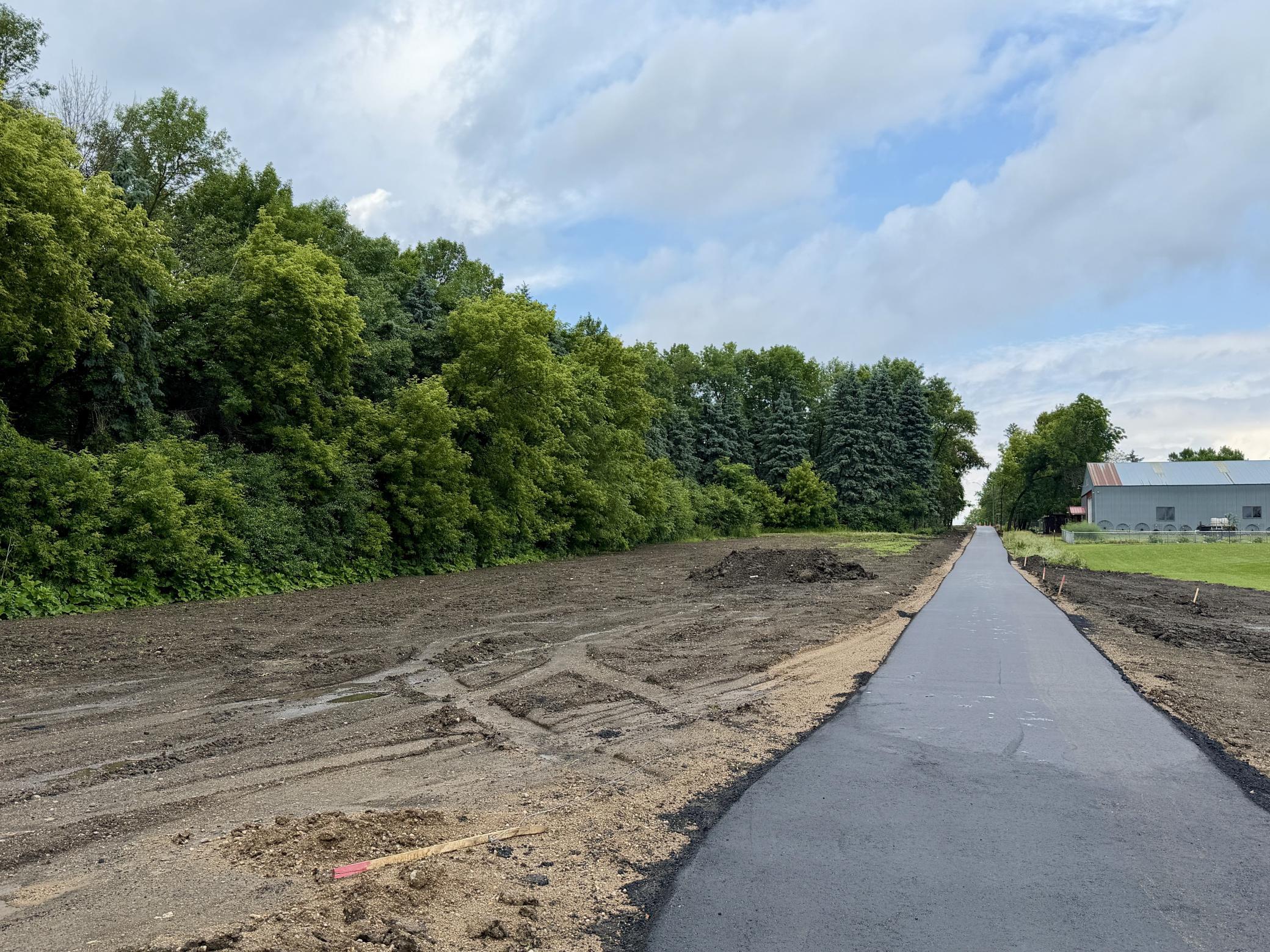 Freshly completed walking path is done. Future community park will be next to the path.