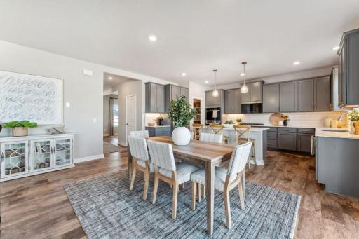 There's ample space for additional furniture, be it buffet or bookshelves. Photo of model home, colors and finishes are similar.