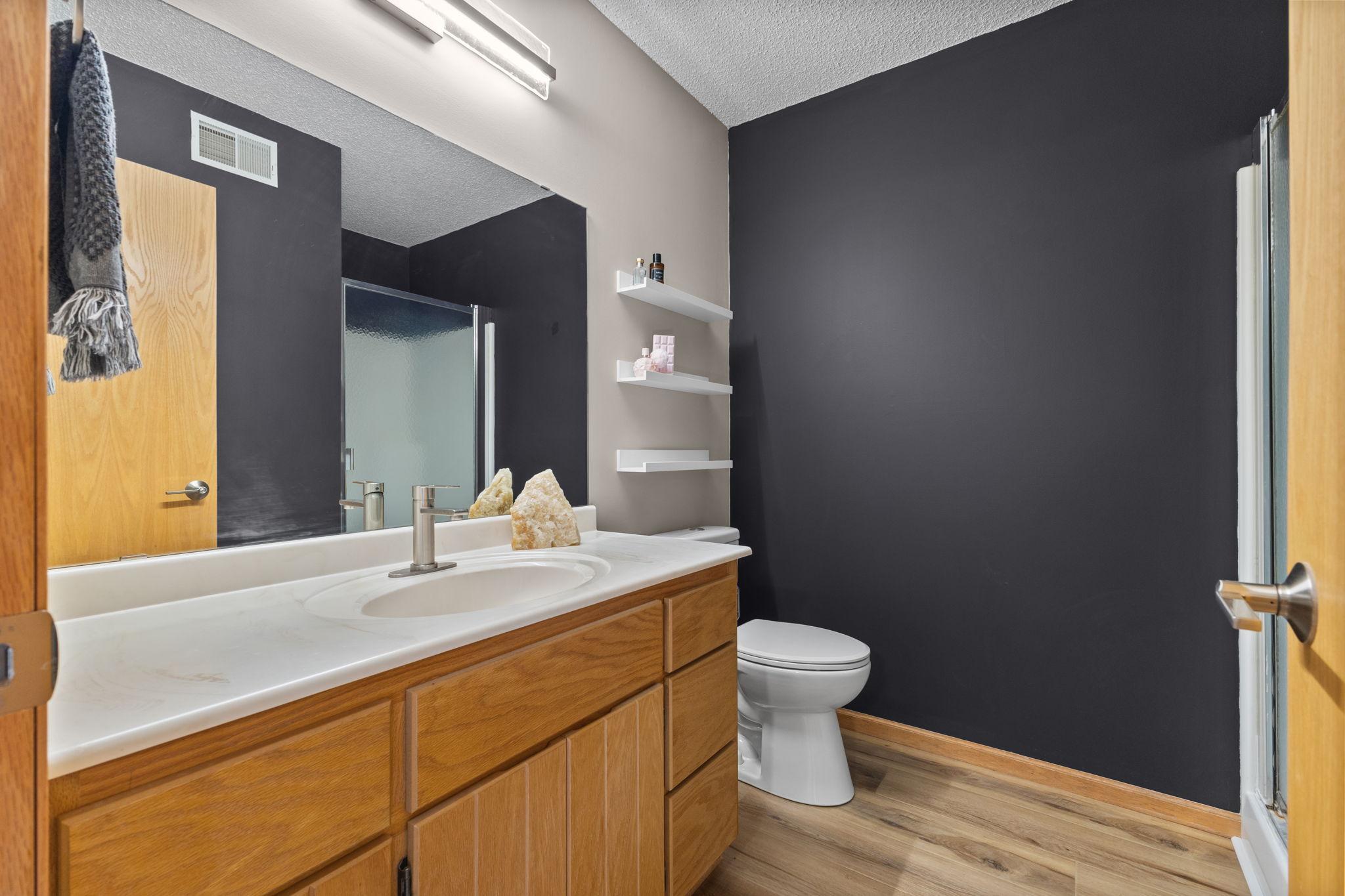 Primary bath with new fixtures/flooring