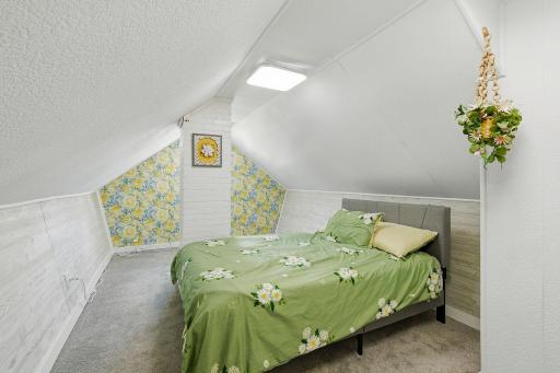 This upper level bedroom is very spacious and unique.