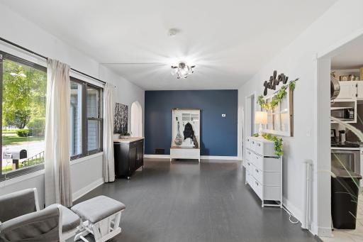 What a spacious, tastefully decorated flex space - could be a dining room or living room - whatever your needs demand!