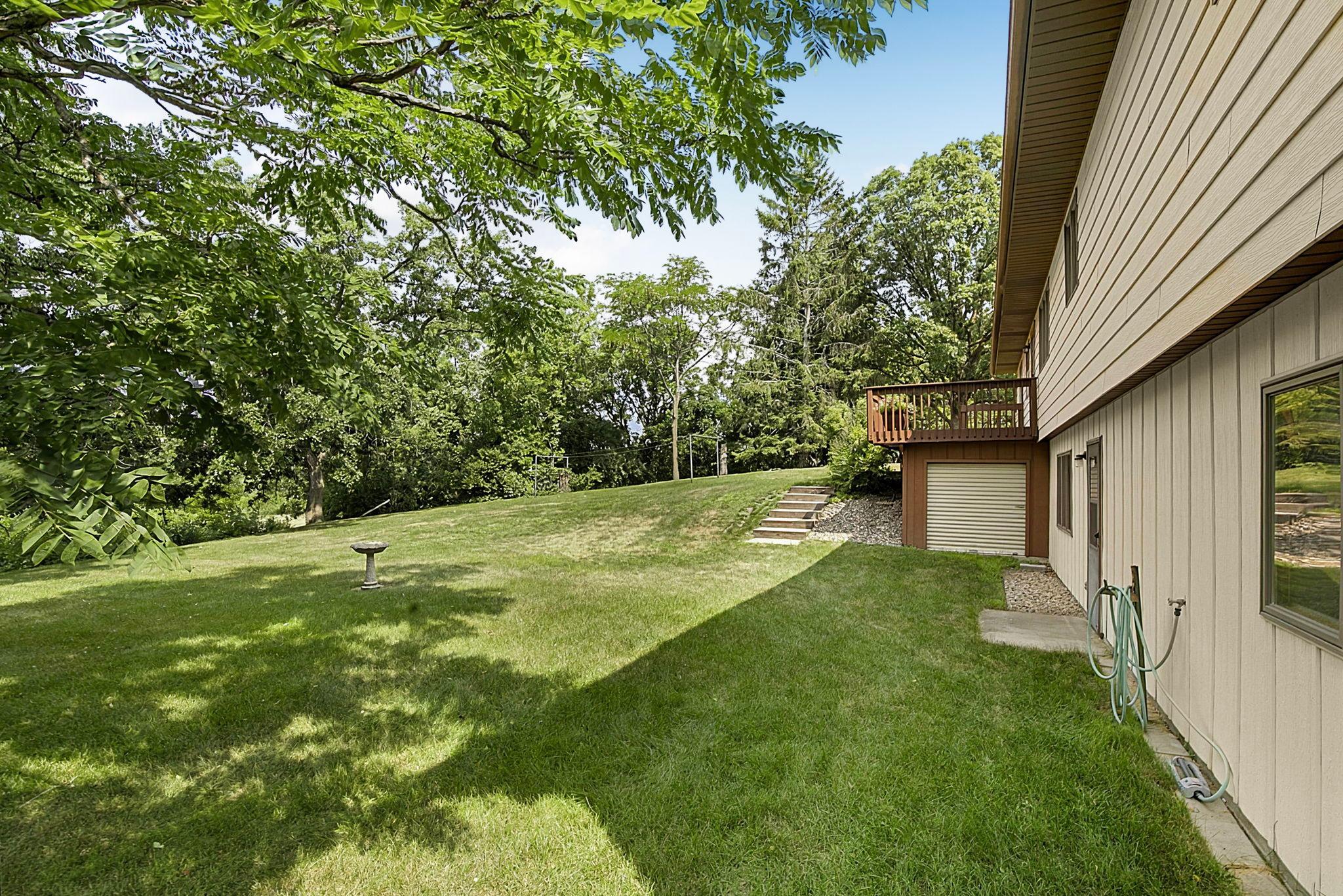 Mature yard with plenty of room to roam or entertain + Tuck under storage shed