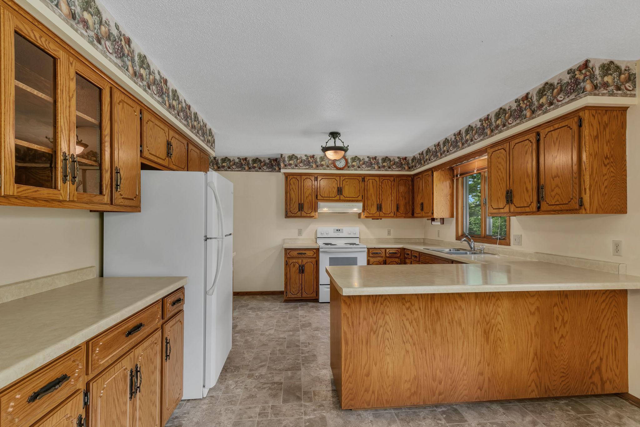 Eat-in kitchen with additional banquet storage to accompany the dining space. Great storage in this kitchen!