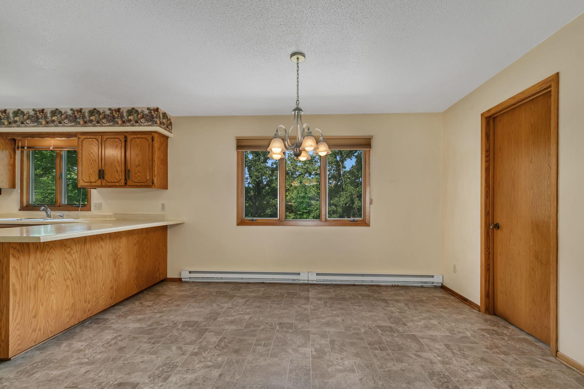 Another view of the dining space. The door on the right leads to the great flex room with deck access! Think office, sitting room, play room, hobby room or even a large mud room - whatever fits your lifestyle