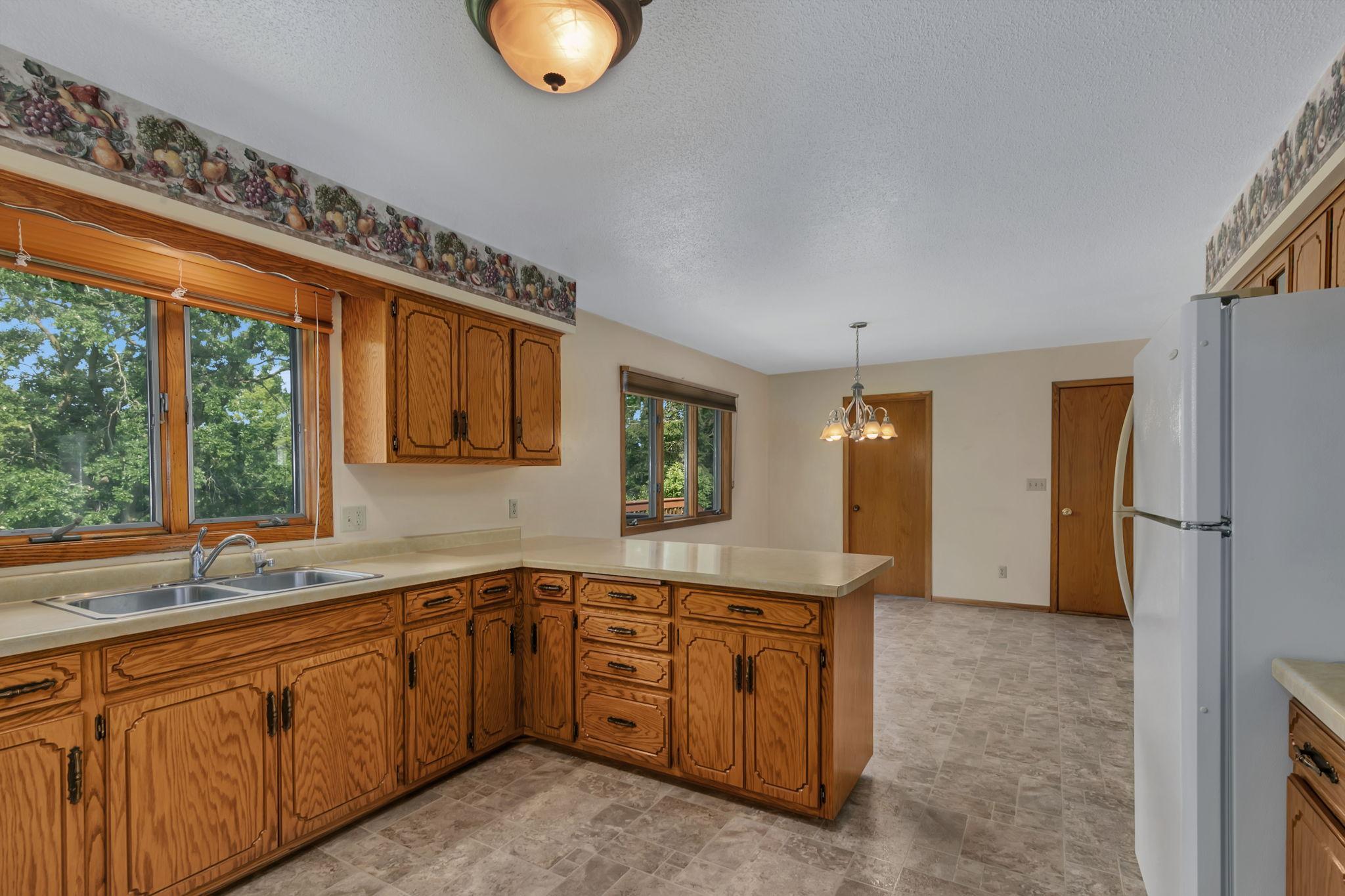 Window at sink perfect for keeping an eye on the backyard or simply to take in the views of nature