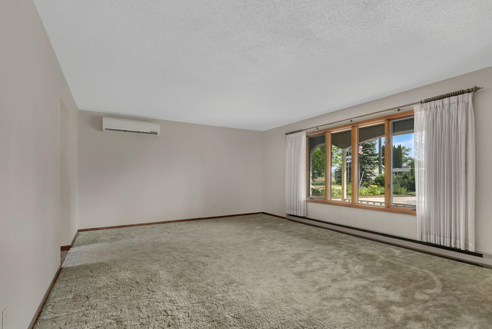 Front living room - the full wall of windows create a bright and relaxing space.