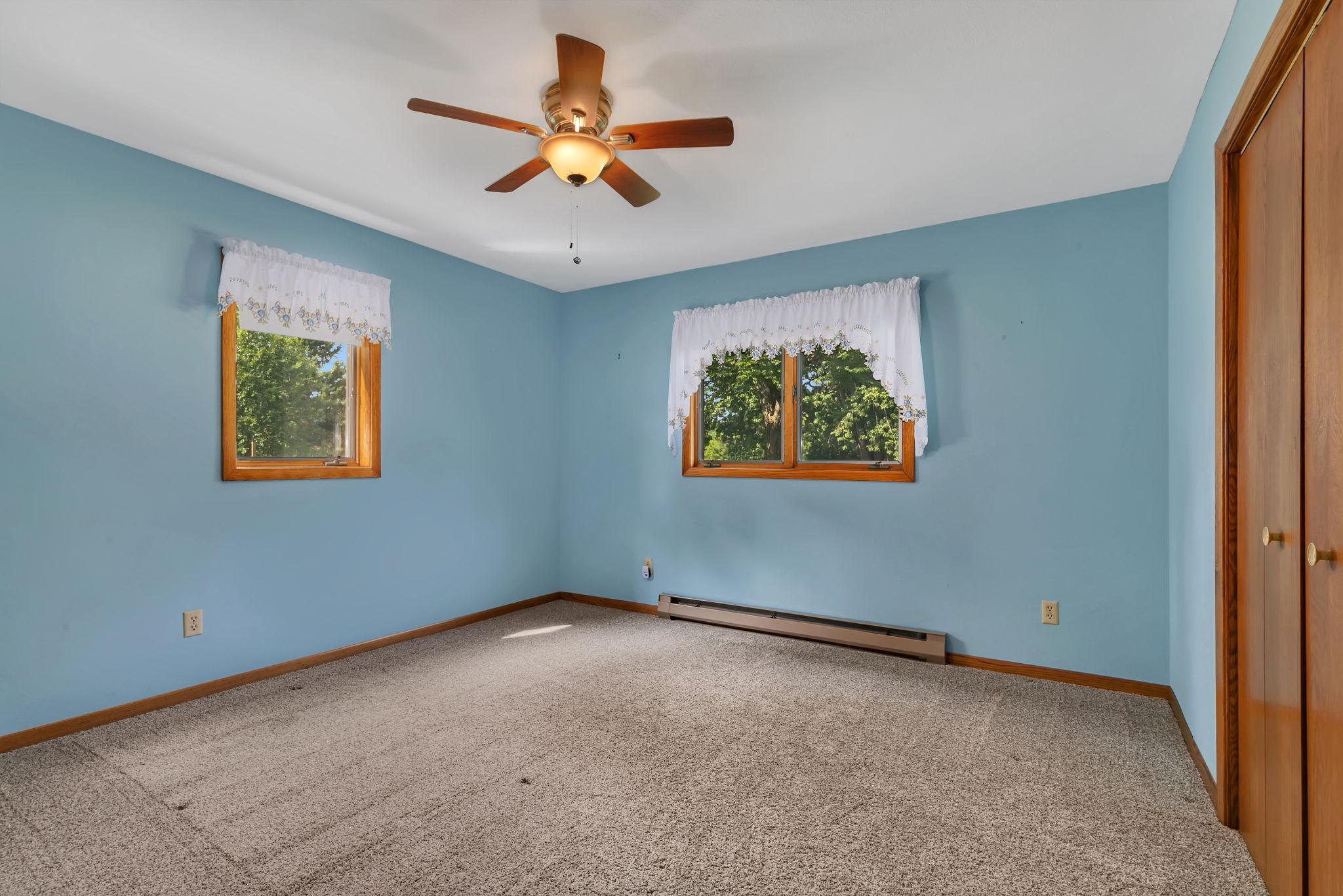 Third bedroom is on the lower level with backyard views