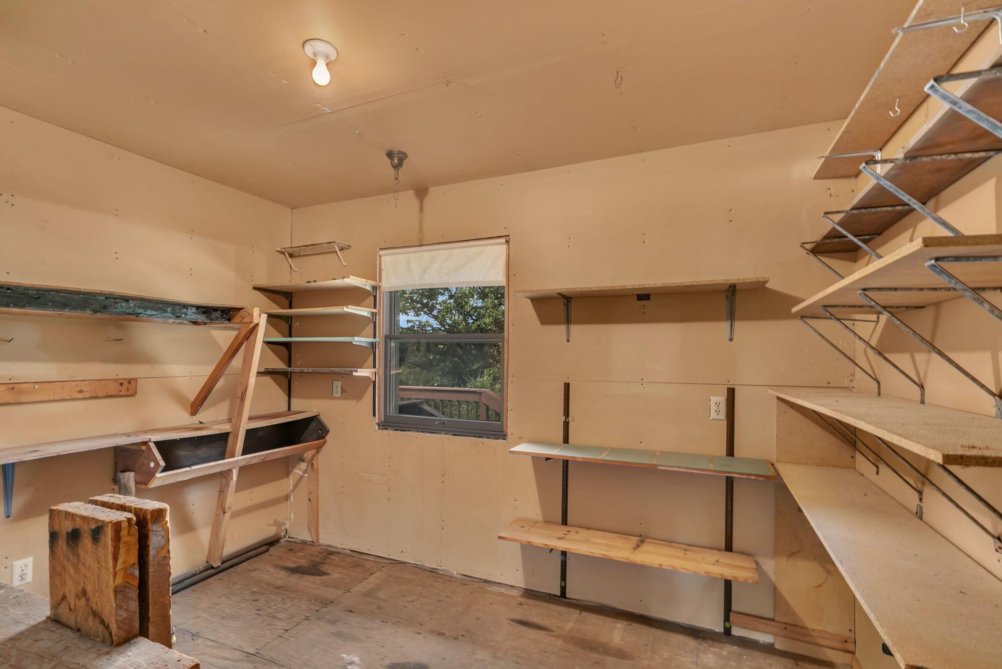 Shop located on the back end of the attached garage - perfect hobby space or additional storage