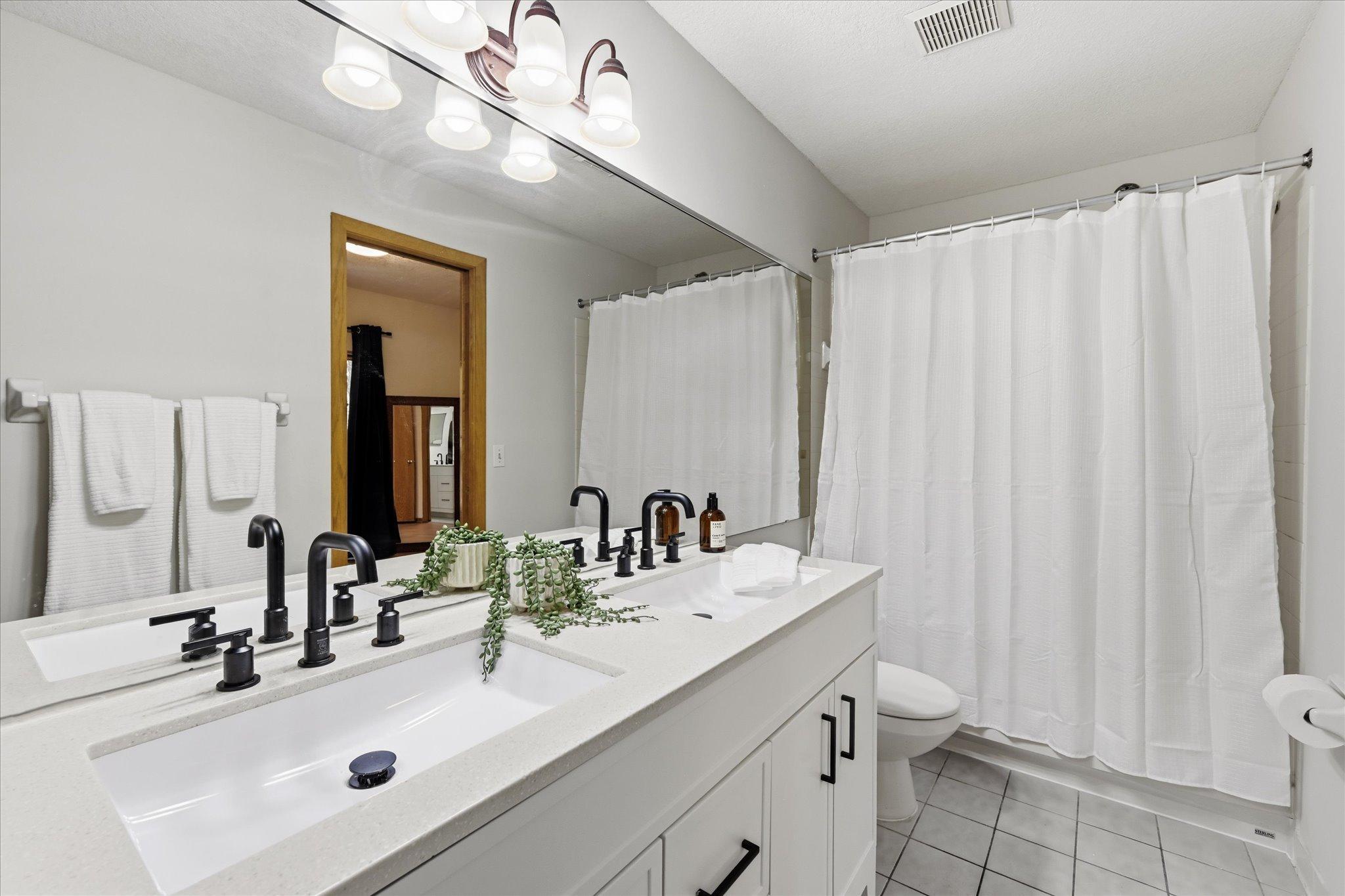 Brand new double vanity with second sink added! Full walk through bath.