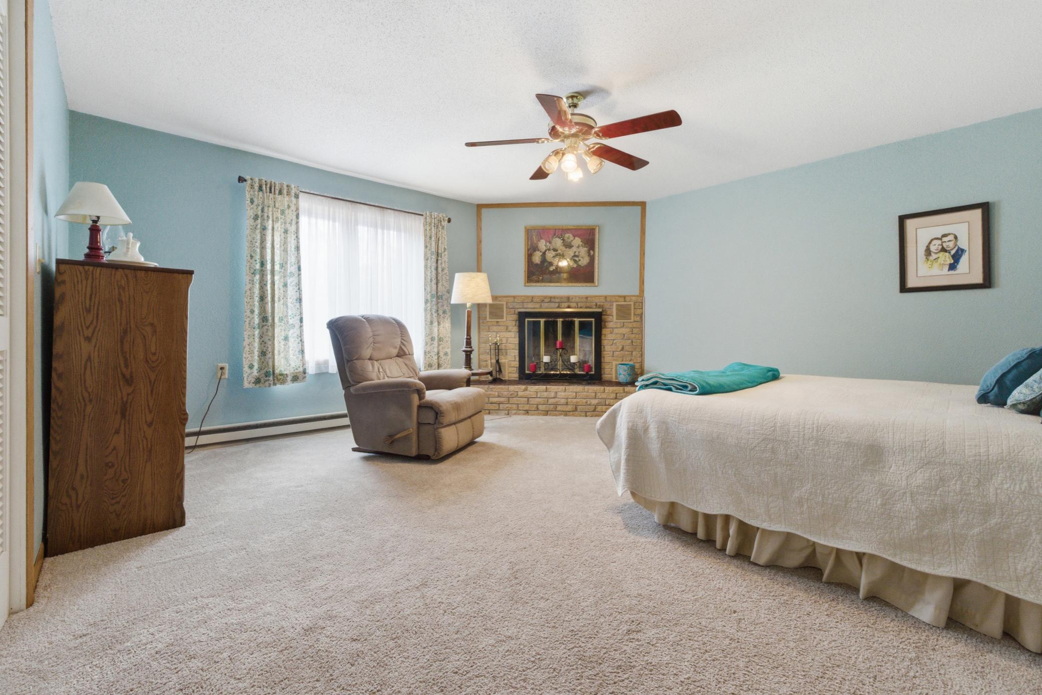 Main floor primary bedroom, fireplace for show not functional