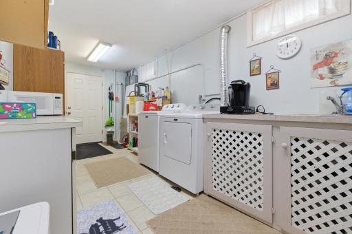 Laundry and utility room coming in from 2 car attached garage