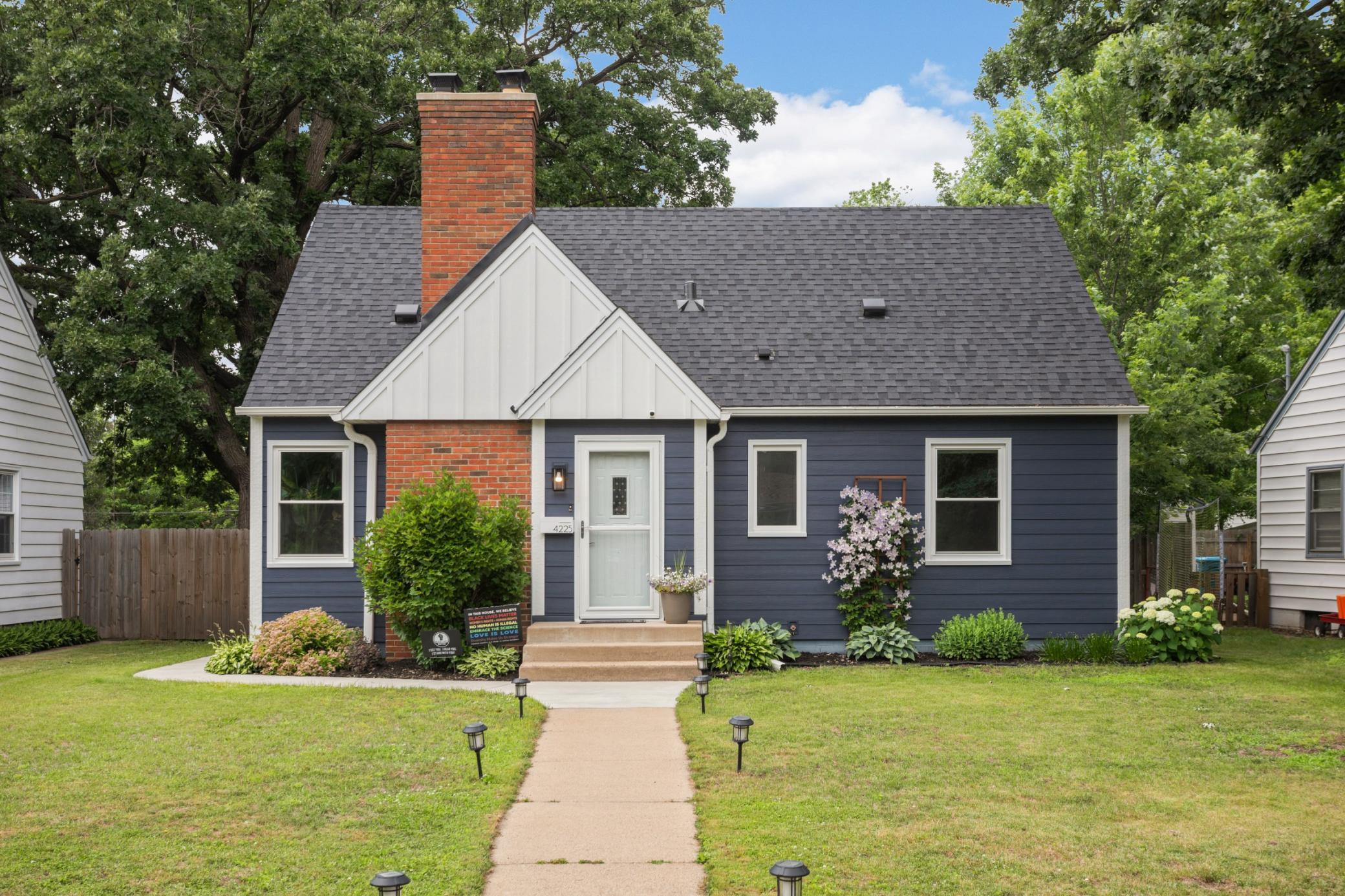Brand new Hardie Board siding, Architectural Shingles, windows, landscaping, concrete walkways
