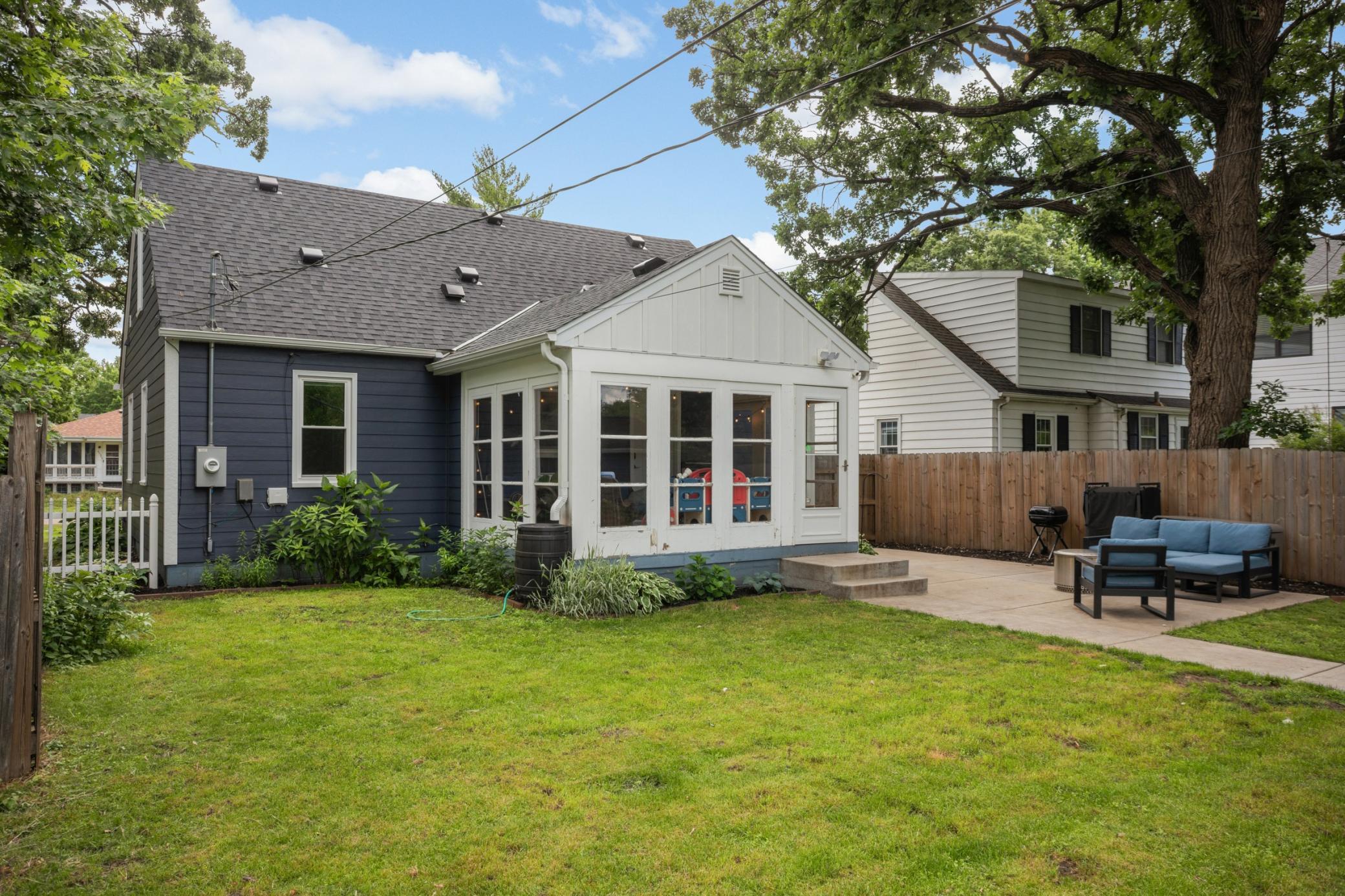 Large yard for yard games, playset, raised garden beds