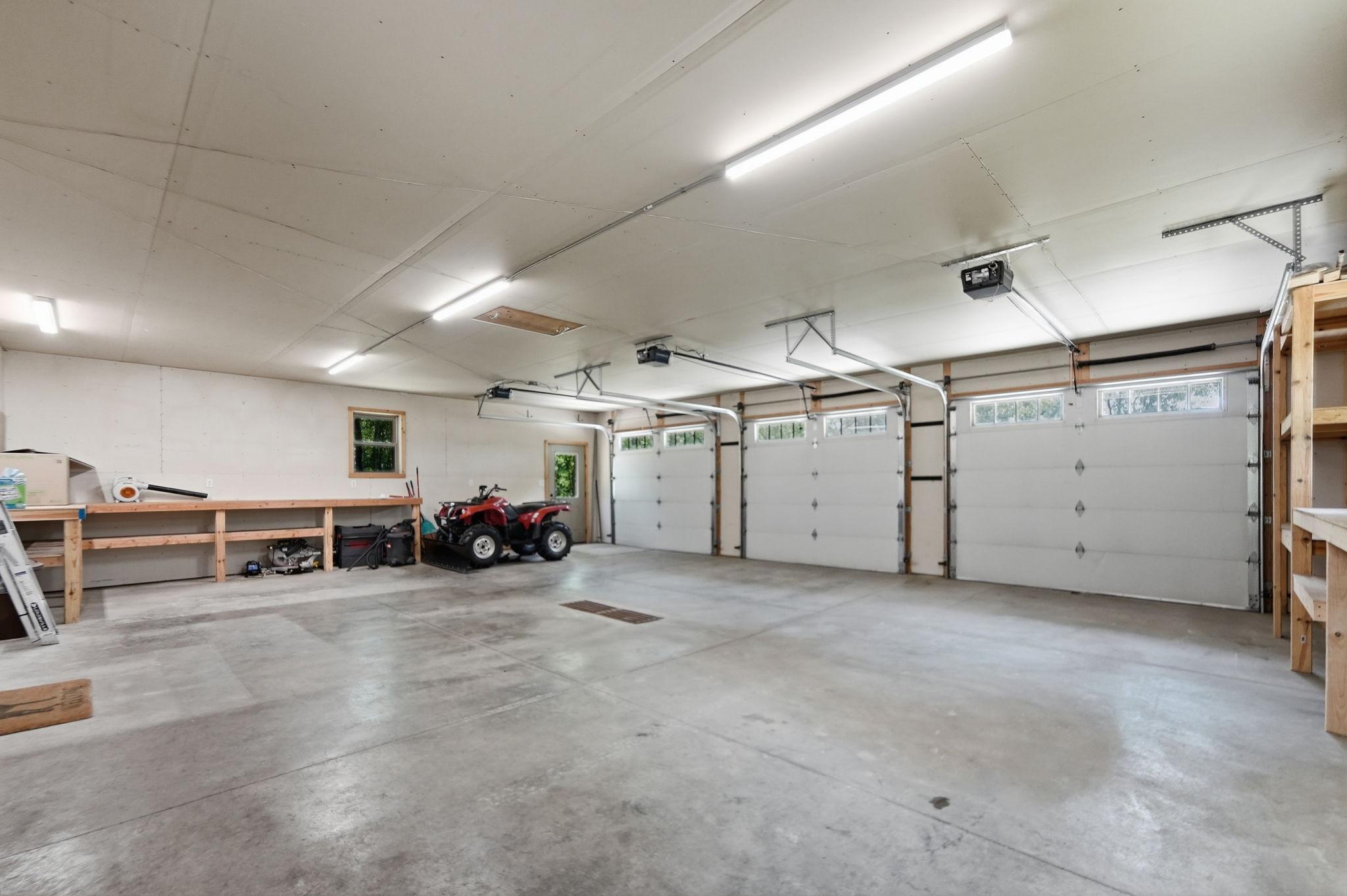 Large, heated 3 stall attached garage