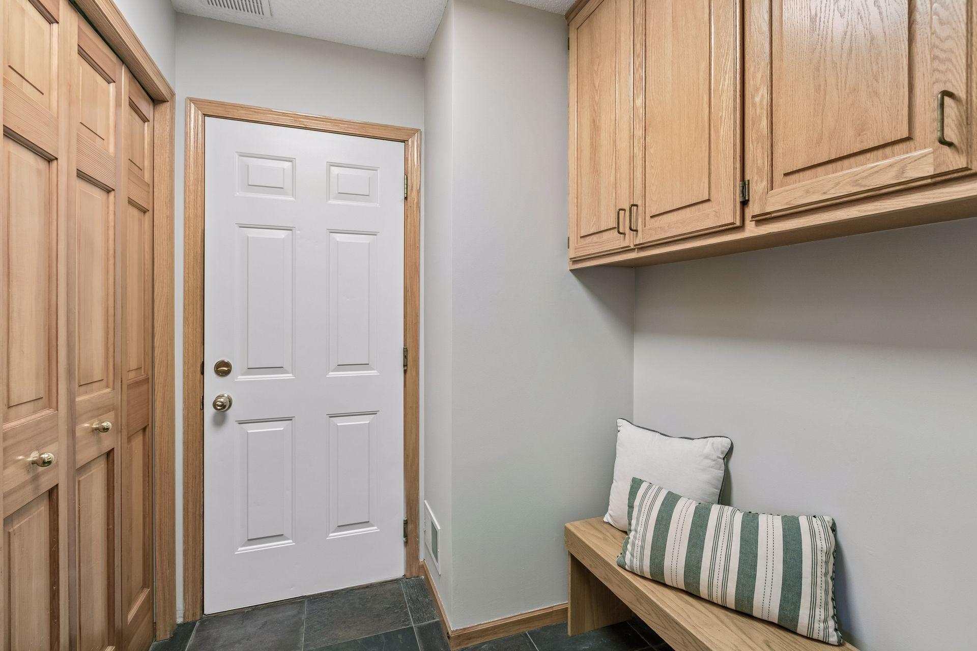Mudroom with door straight into 3 car garage, large closet with lots of storage. washer/dryer hookup available in this room.