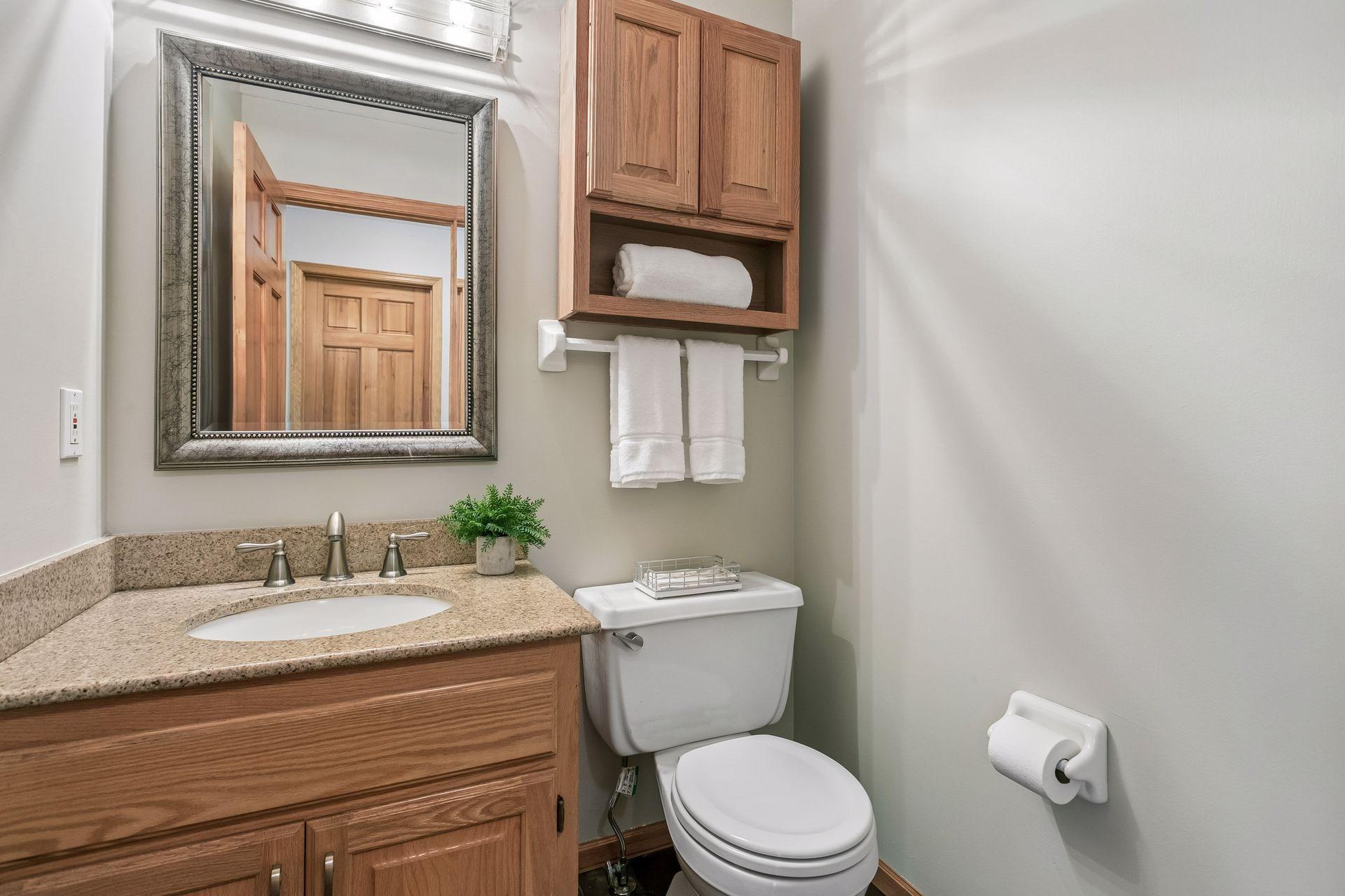 Half bath just off of the kitchen and straight across from the mudroom and office.