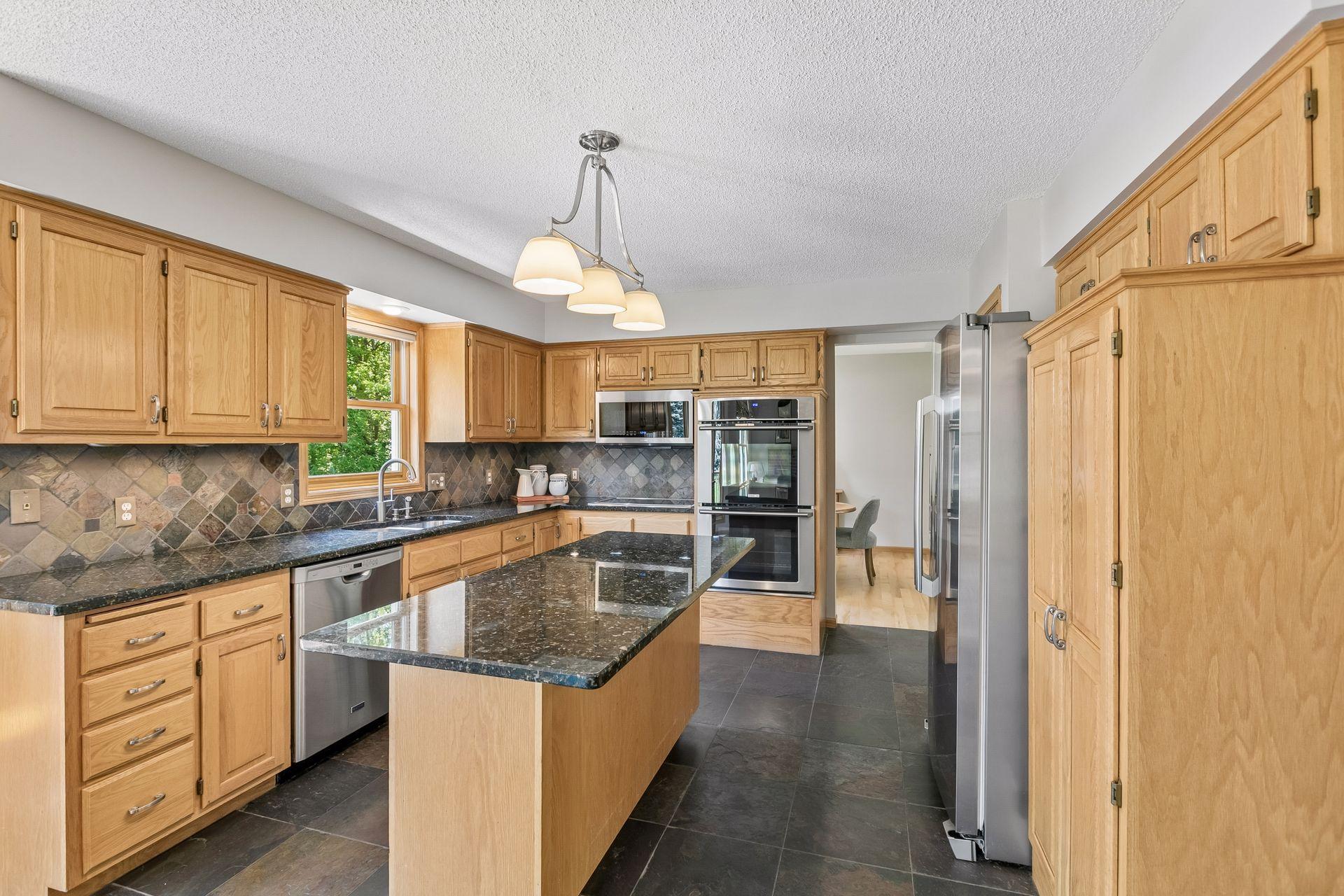 All stainless steel appliances in kitchen.