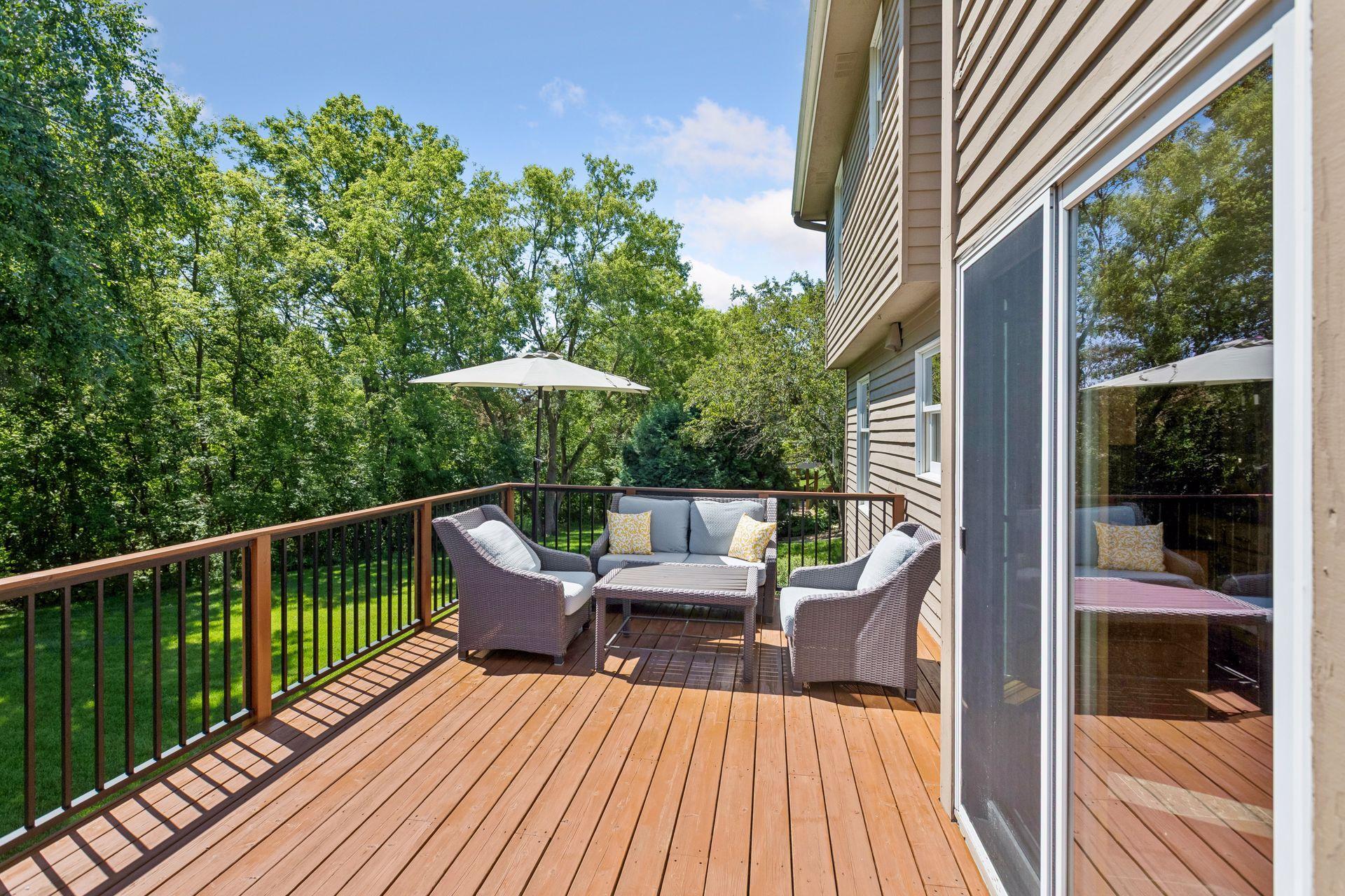 Large deck with seating and grill area.