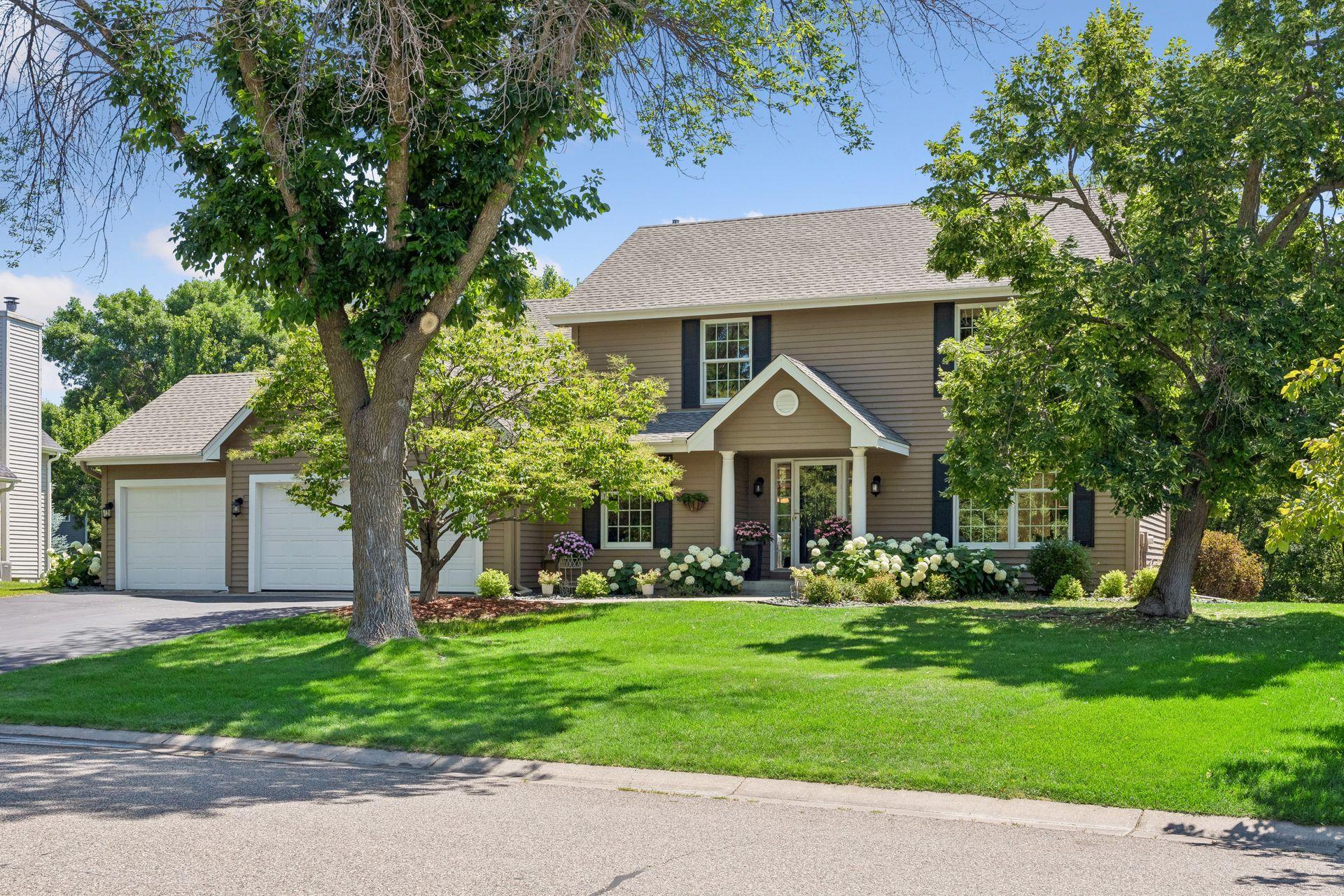Front of house in Churchill Farms on level private lot just under .5 acres.