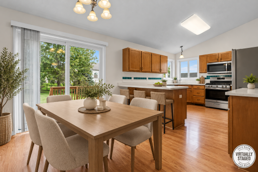 Virtually Staged - View of Deck and Backyard from Dining Room - Main Level