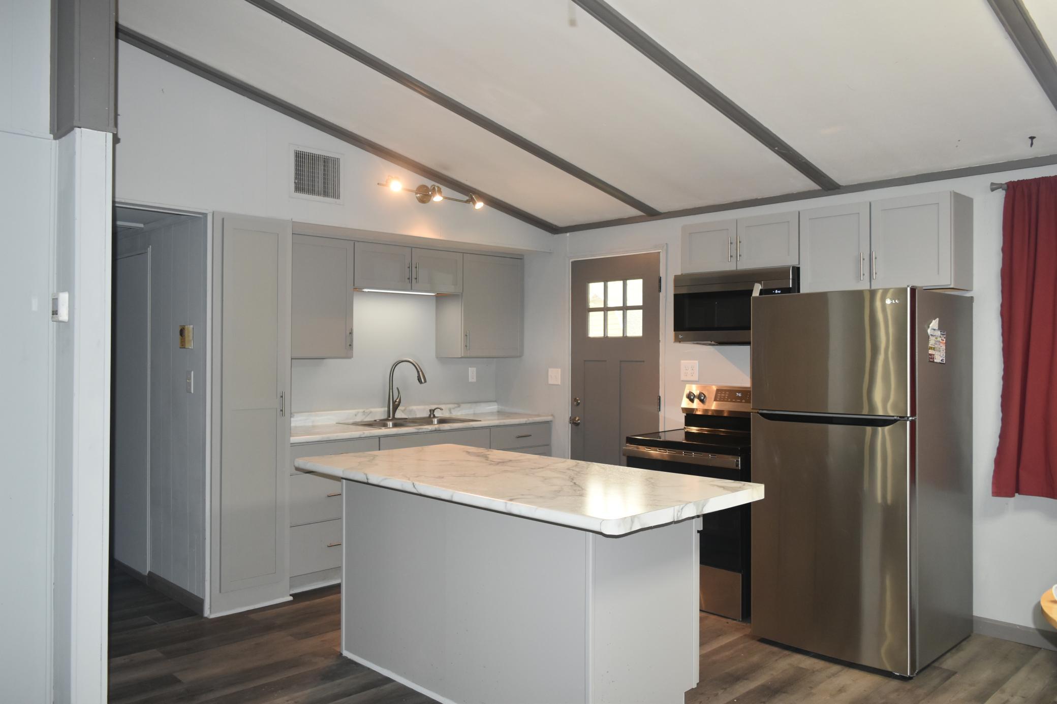 Kitchen with stainless appliances.