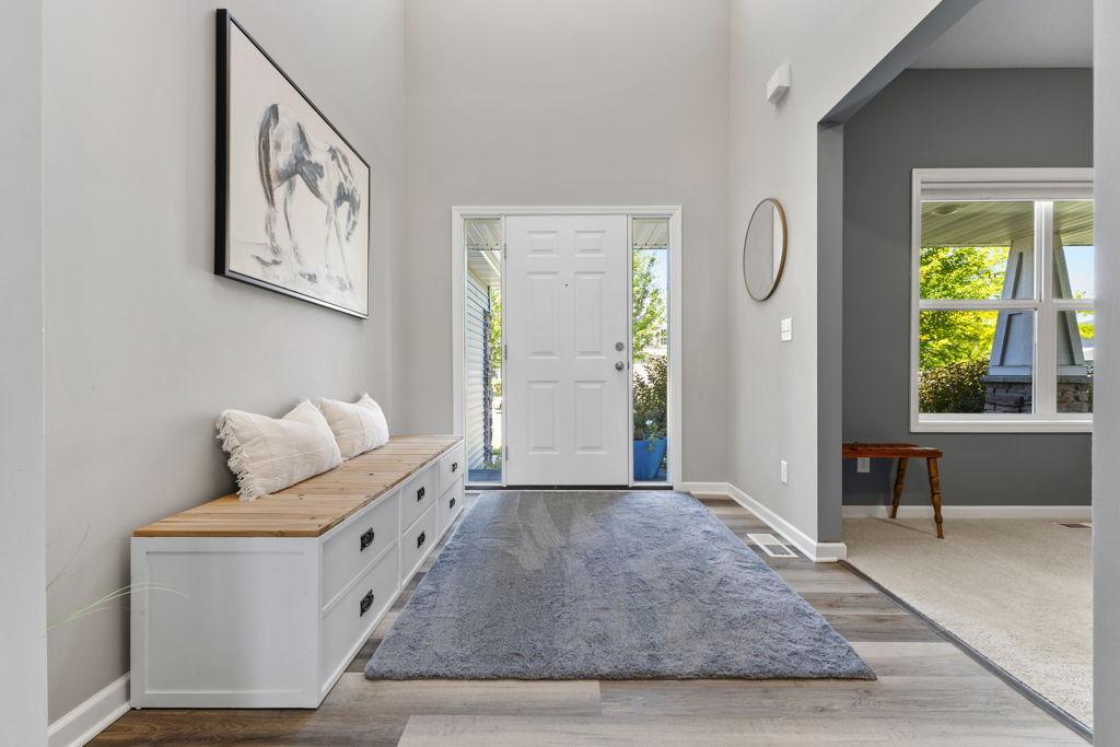 This entryway is fresh and inviting. The space to the right is currently used as an office but has the potential to be many other things depending on your lifestyle.
