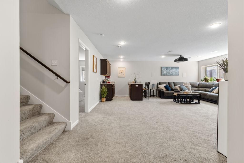 The lower level consists of a bar/entertaining area, a family room, a 5th bedroom, a flex room, a 3/4 bathroom and the mechanical/storage room.