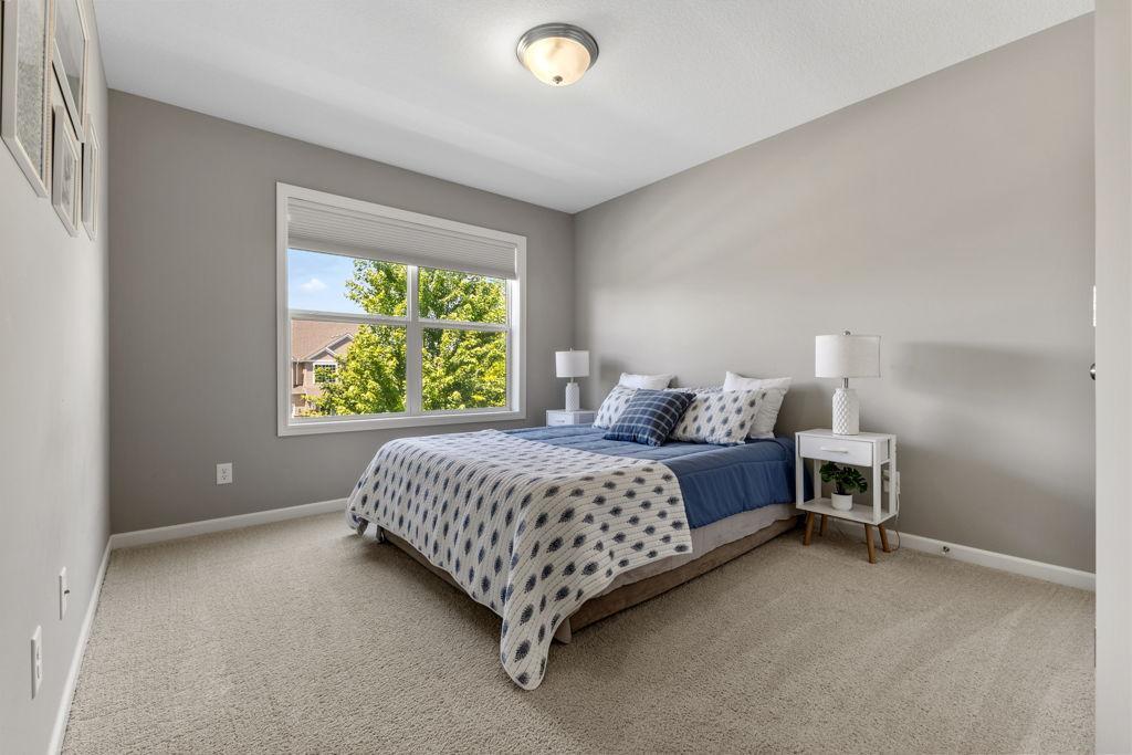 One of the two west facing upper level bedrooms. The closet is to the right of this photo.