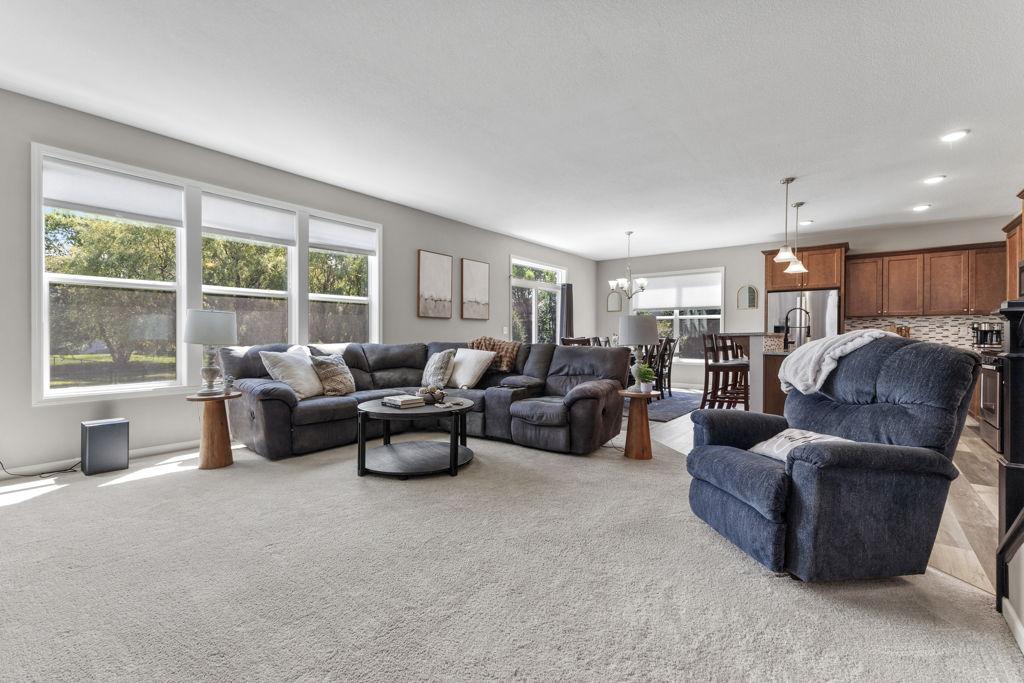 This main level living room is generously sized as is the additional family room in the lower level. The natural light is amazing. Breakfast bar and a large dining space for easy entertaining and everyday life.